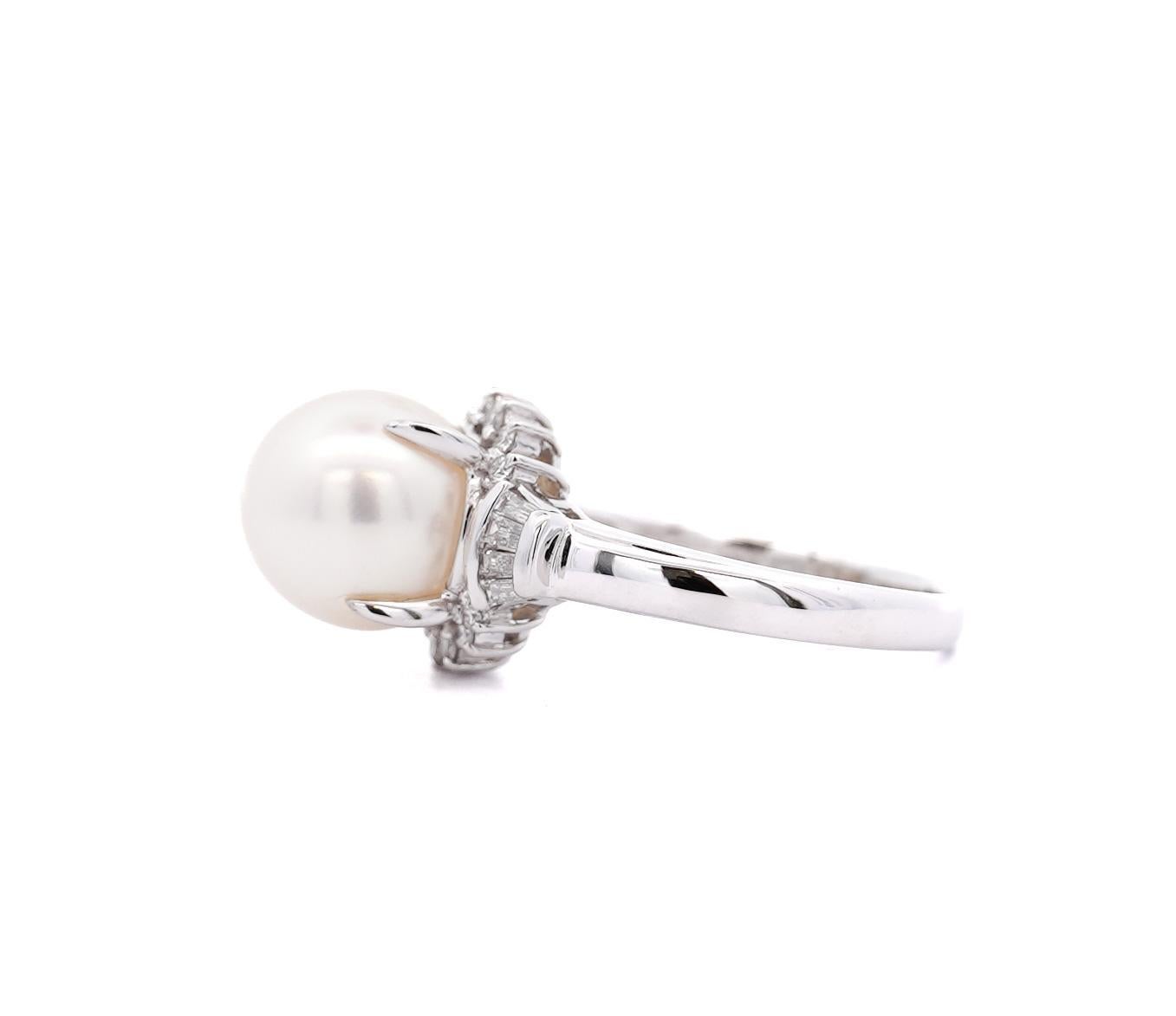 9.5mm South Sea Cultured Pearl and Diamond Ring in Platinum. The white pearl is surrounded by round cut shining diamonds on the top and bottom and 4 tapered baguette cut diamonds on each side. Platinum setting with ring size of 6. Weighs 6.82