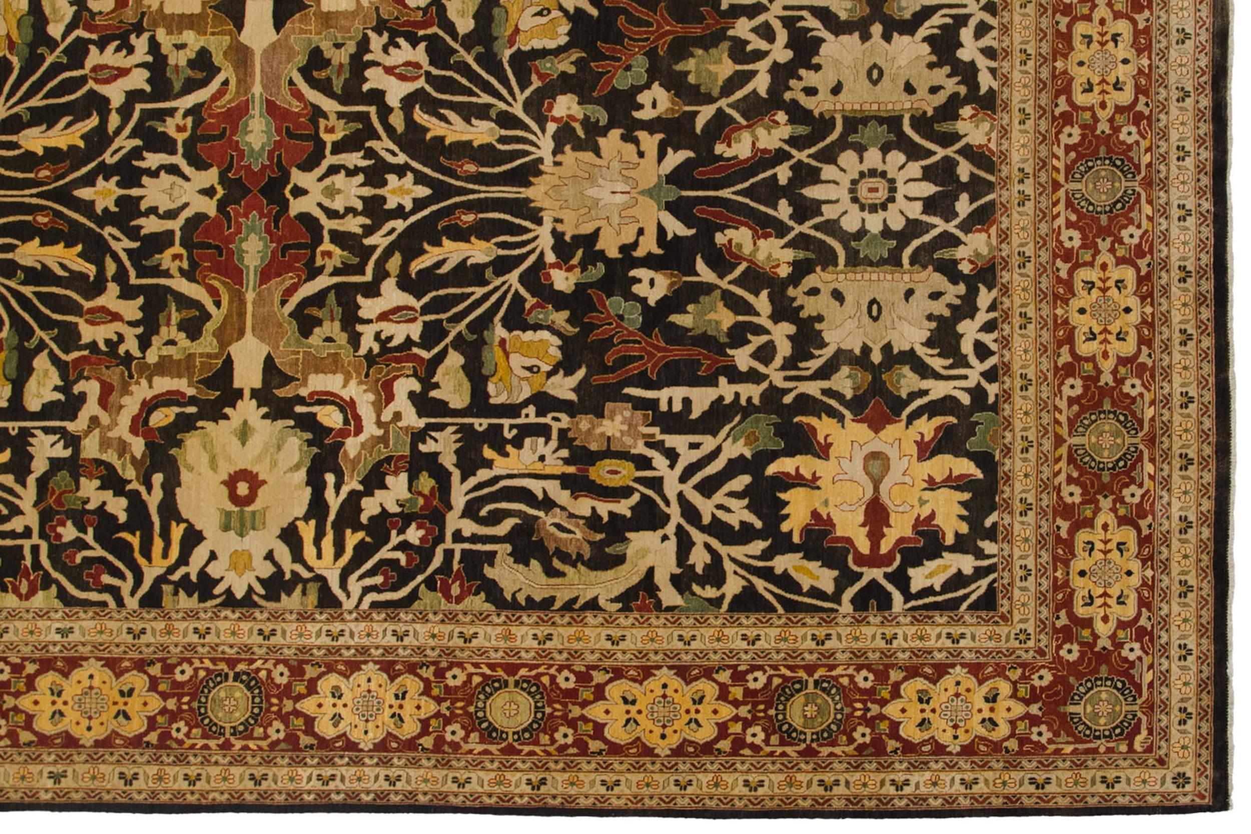 :: Finely knotted and exquisitely executed allover covered field in large scale floral palmettes interconnected by sprawling vinery adorned with large expressive leaves and budded blossoms. High quality soft wool with abrashes across. Colors and