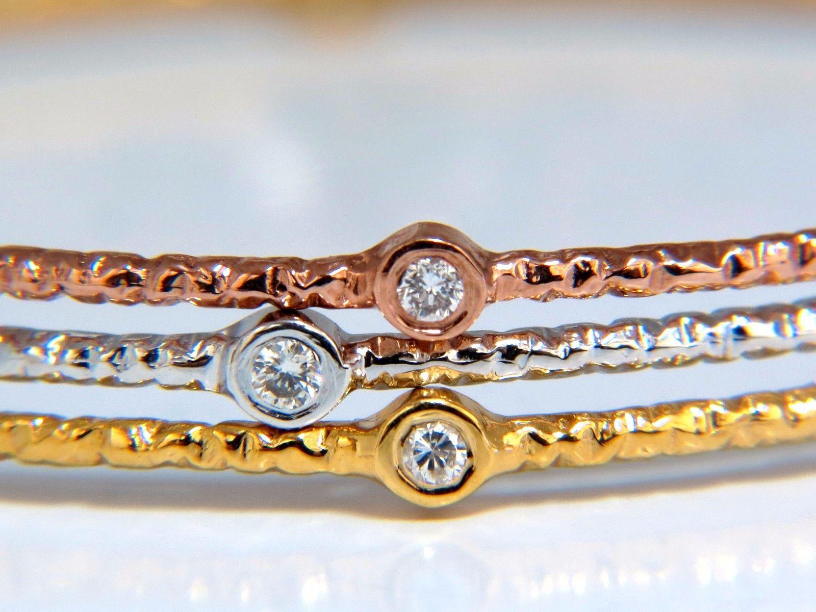 The Stackable Eternity's 

Tricolor Gold Bangle Bracelets With Hammered Rustic Finish

.96ct natural diamonds bangle bracelet

Rounds & Full cut brilliants

G-color vs-2 clarity.

14kt. white, yellow & rose gold.

Each bracelet made for the 7 inch