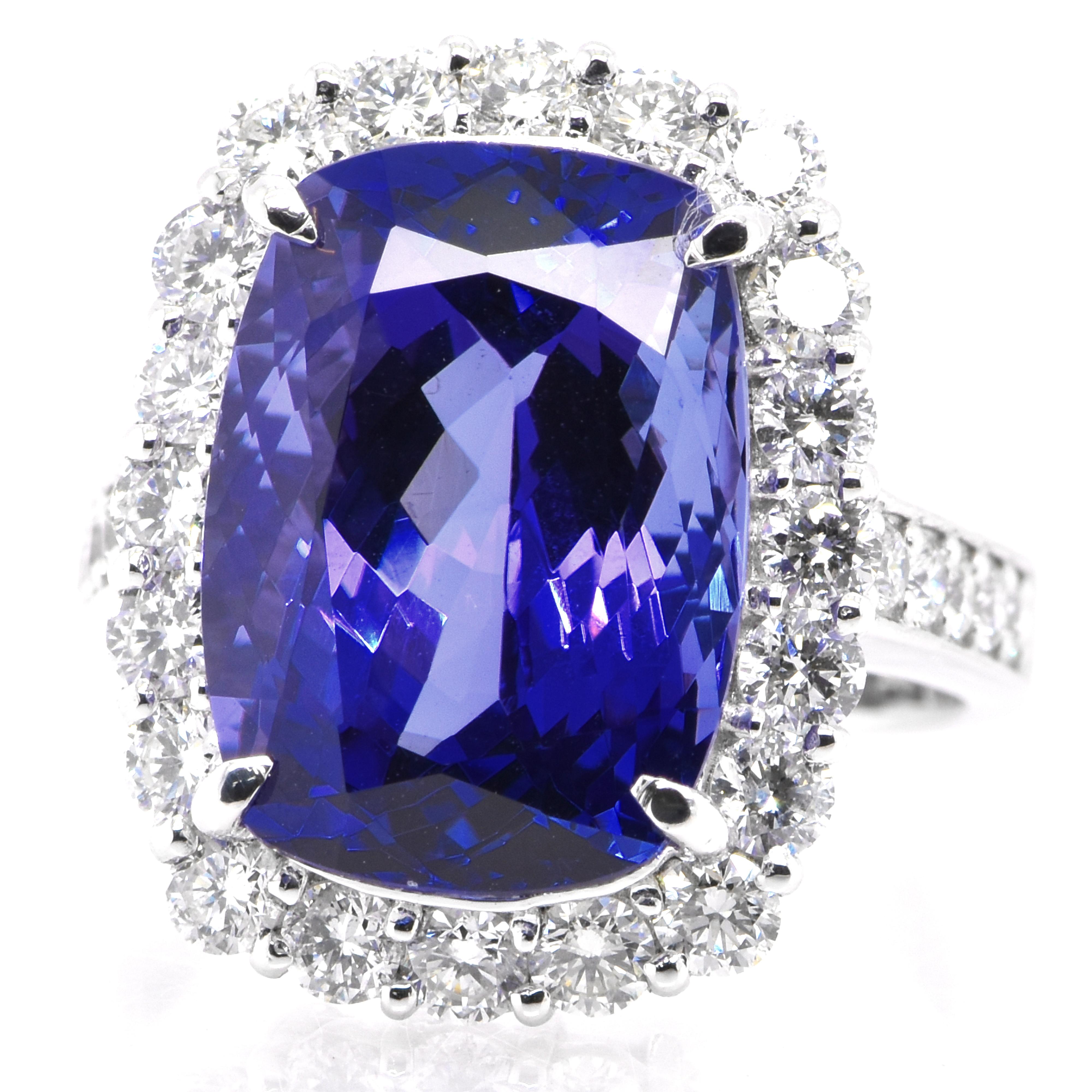 A beautiful ring featuring a 9.60 Carat Natural Tanzanite and 1.45 Carats Diamond Accents set in Platinum. Tanzanite's name was given by Tiffany and Co after its only known source: Tanzania. Tanzanite displays beautiful pleochroic colors meaning