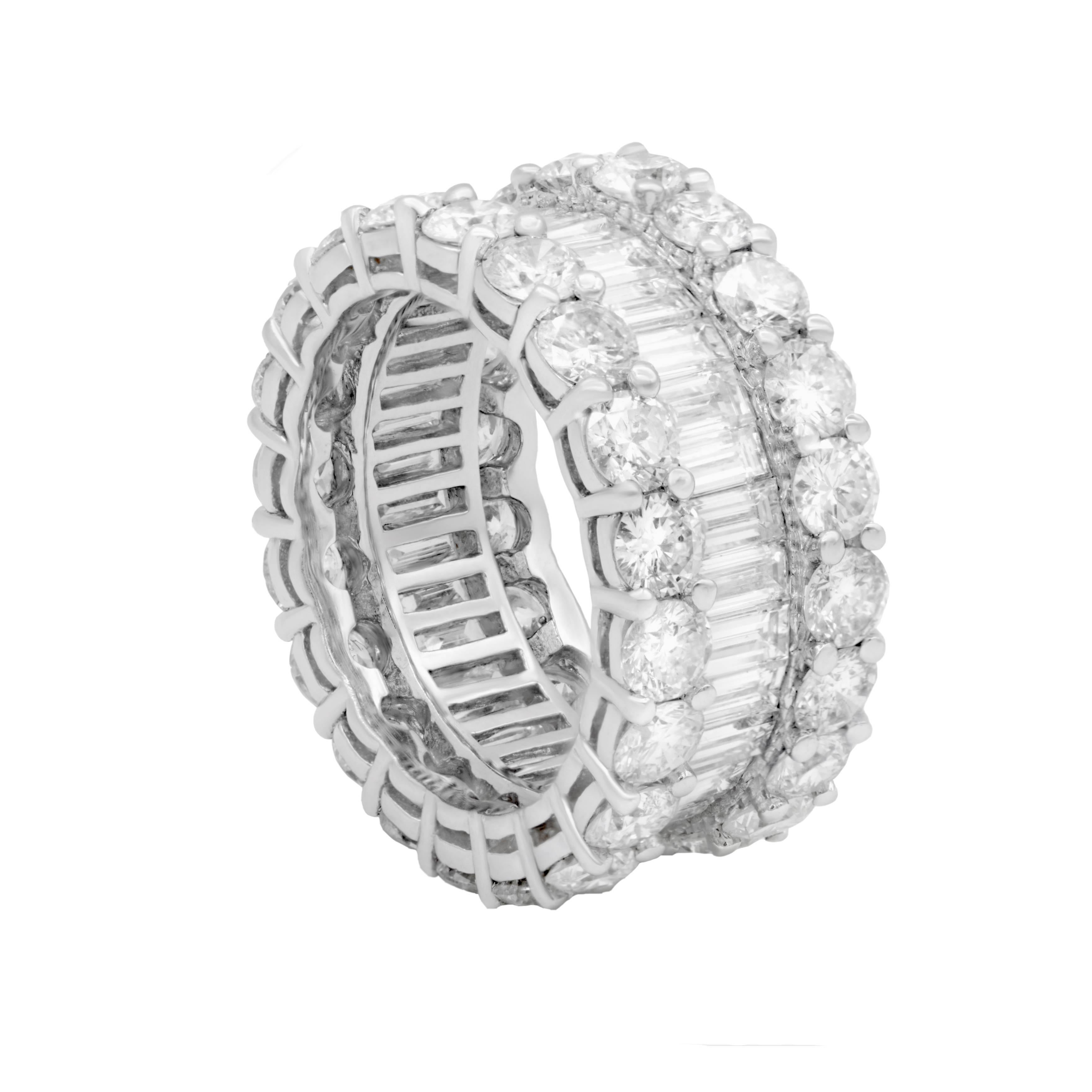 Magnificent diamond eternity band with one row of baguette diamonds and surrounded by  round cut diamonds all the way round, weighing 9.60 carats total FG color and Slightly Included clarity set in custom made 18 karat white gold mounting.  
Finger
