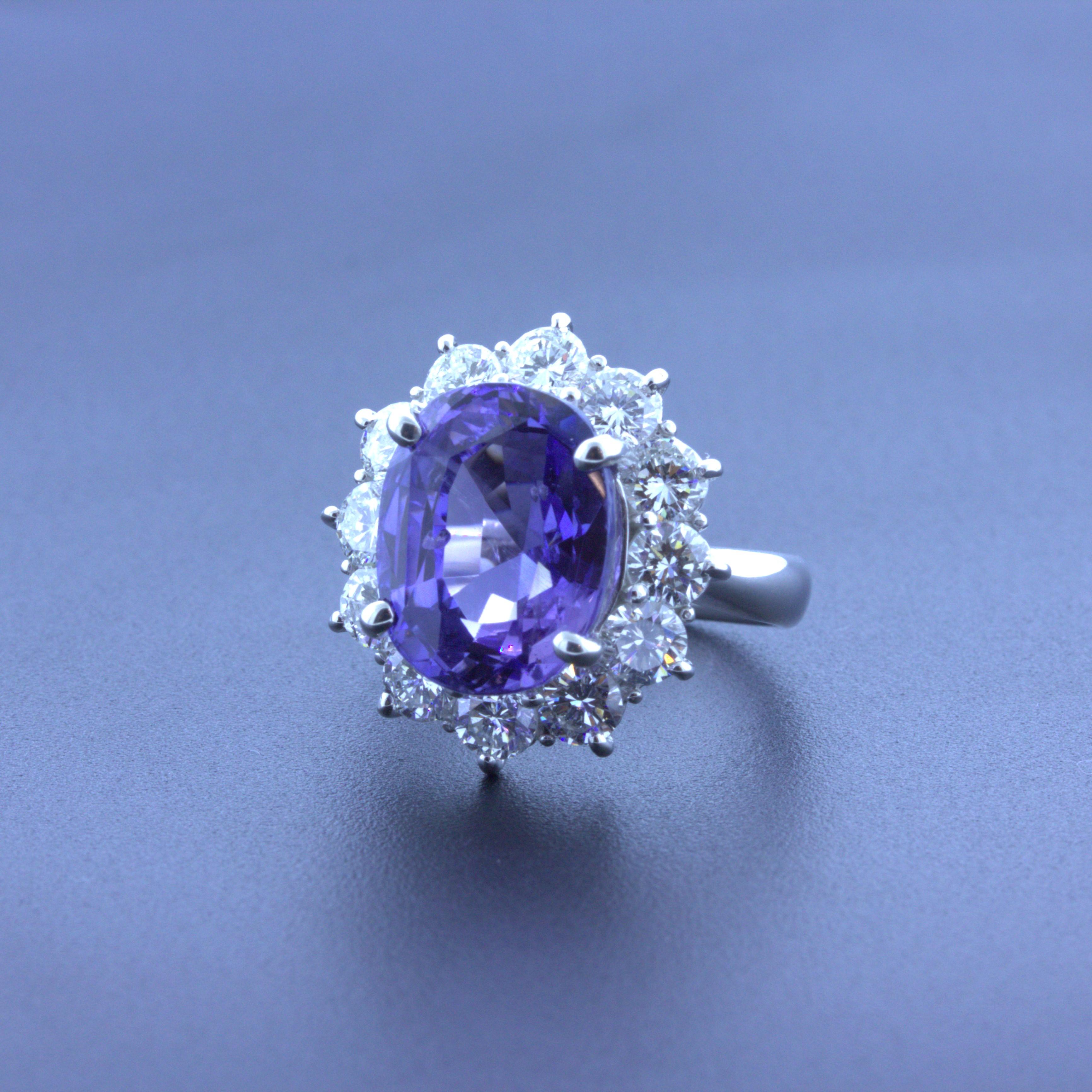 A beautiful and rare Ceylon sapphire takes center stage of this platinum made ring. The sapphire weighs an impressive 9.60 carats and has a unique phenomenon, color-change. In different types of lighting the sapphire changes from a purple/violet
