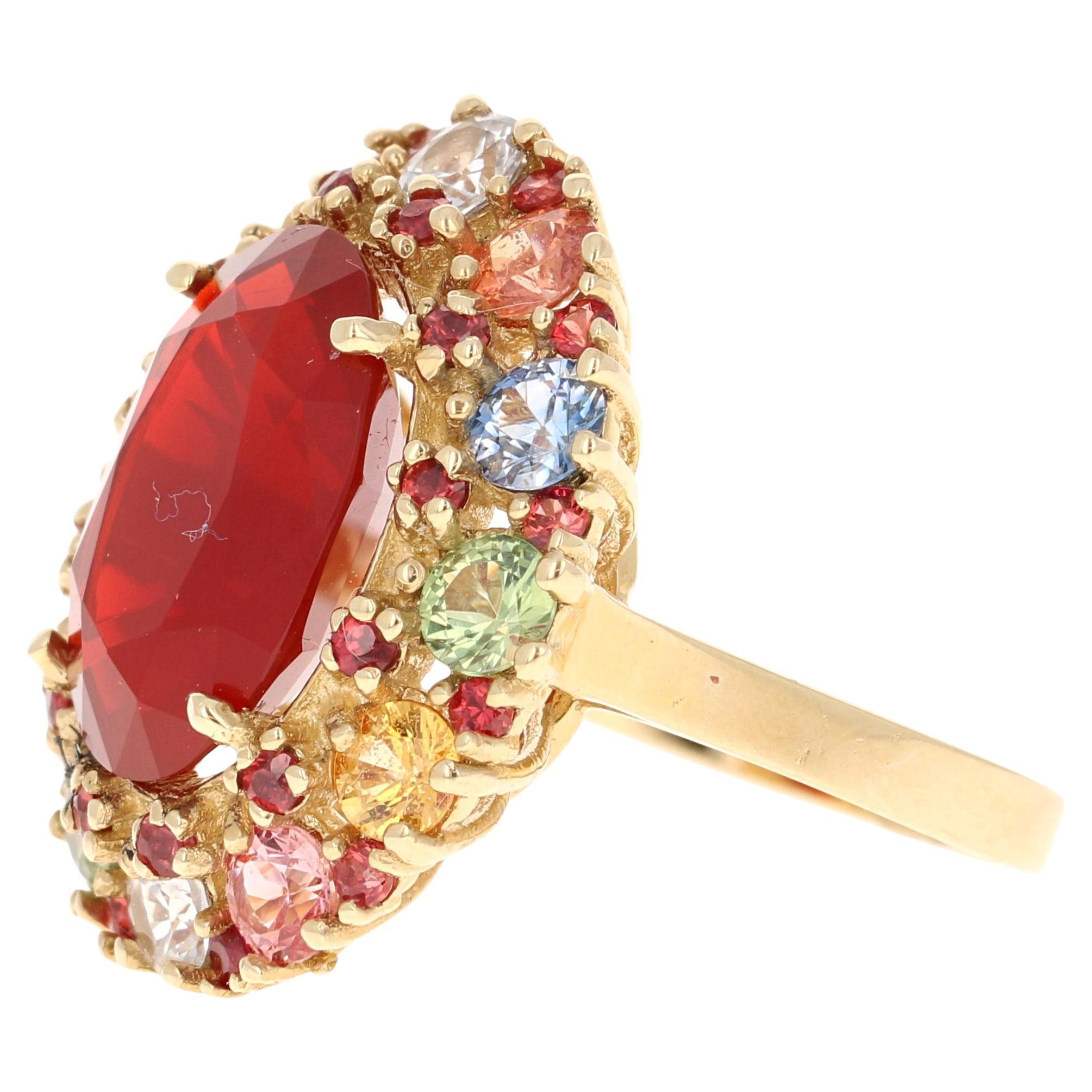 9.61 Carat Natural Fire Opal Multi Color Sapphire Yellow Gold Ring

This ring has a Natural Oval Cut Red Fire Opal that weighs 5.70 carats and 12 Natural  Multi Color Sapphires that weigh 3.15 carats.  It is also adorned with 26 Natural Red