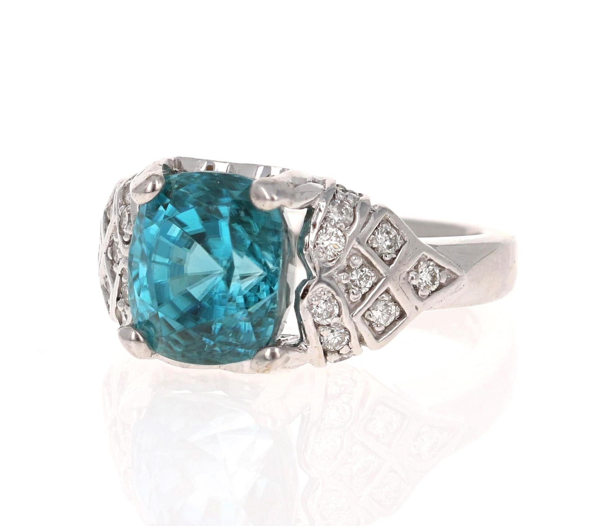 An amazingly deep and beautiful Blue Zircon and Diamond ring that can be a unique Engagement ring for that special someone!
Blue Zircon is a natural stone mined mainly in Sri Lanka, Myanmar, and Australia.  
This ring has a large Cushion/Oval Blue