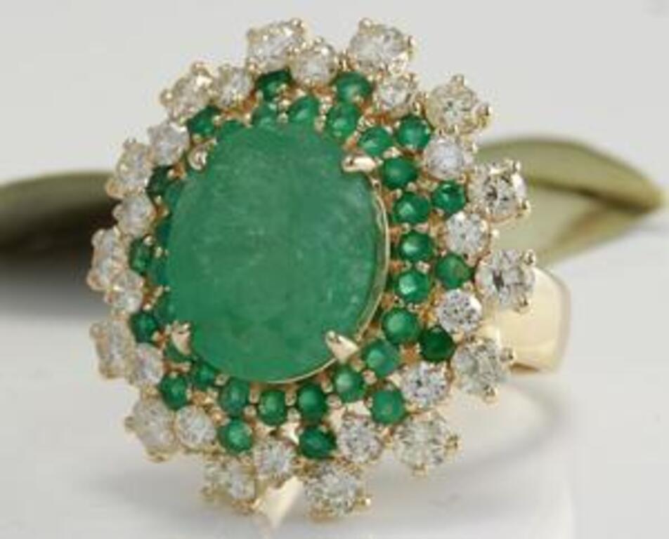 9.64 Carats Natural Emerald and Diamond 14K Solid Yellow Gold Ring

Total Natural Oval and Round Cut Emeralds Weight is: 7.89 Carats

Center Emerald Measures: 14 x 11.78mm

Natural Round Diamonds Weight: 1.75 Carats (color H-I / Clarity