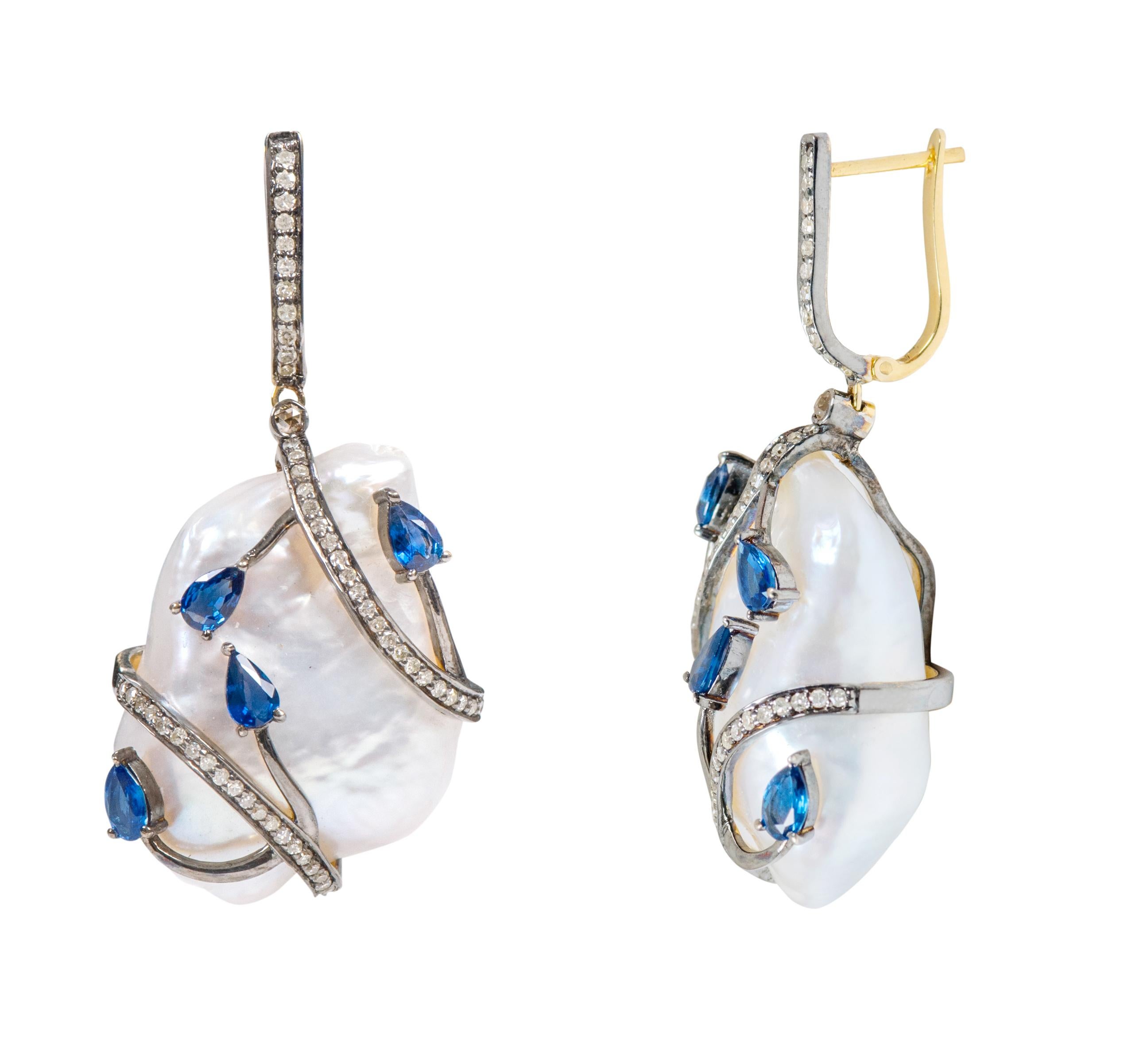 96.44 Carat Baroque Pearl, Sapphire, and Diamond Drop Earrings in Art Deco Style

This Victorian period art-deco style magnificent baroque pearl, sapphire and diamond earring is illustrious. The solitaire uneven uniquely shaped baroque translucent