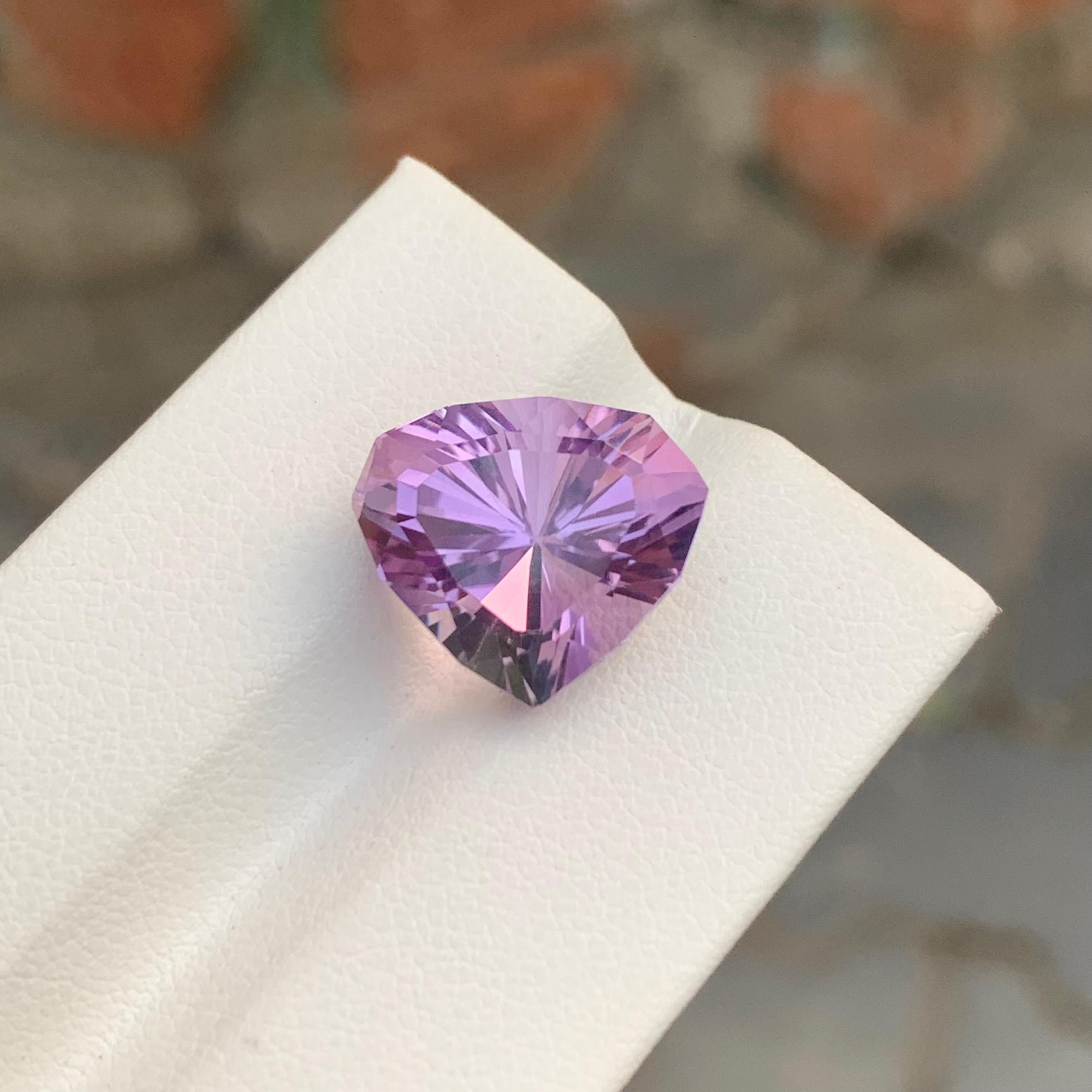 Loose Amethyst
Weight: 9.65 Carats
Dimension: 13 x 14.9 x 10.8 Mm
Colour: Purple
Origin: Brazil
Treatment: Non
Certificate: On Demand
Shape: Trillion 

Amethyst, a stunning variety of quartz known for its mesmerizing purple hue, has captivated