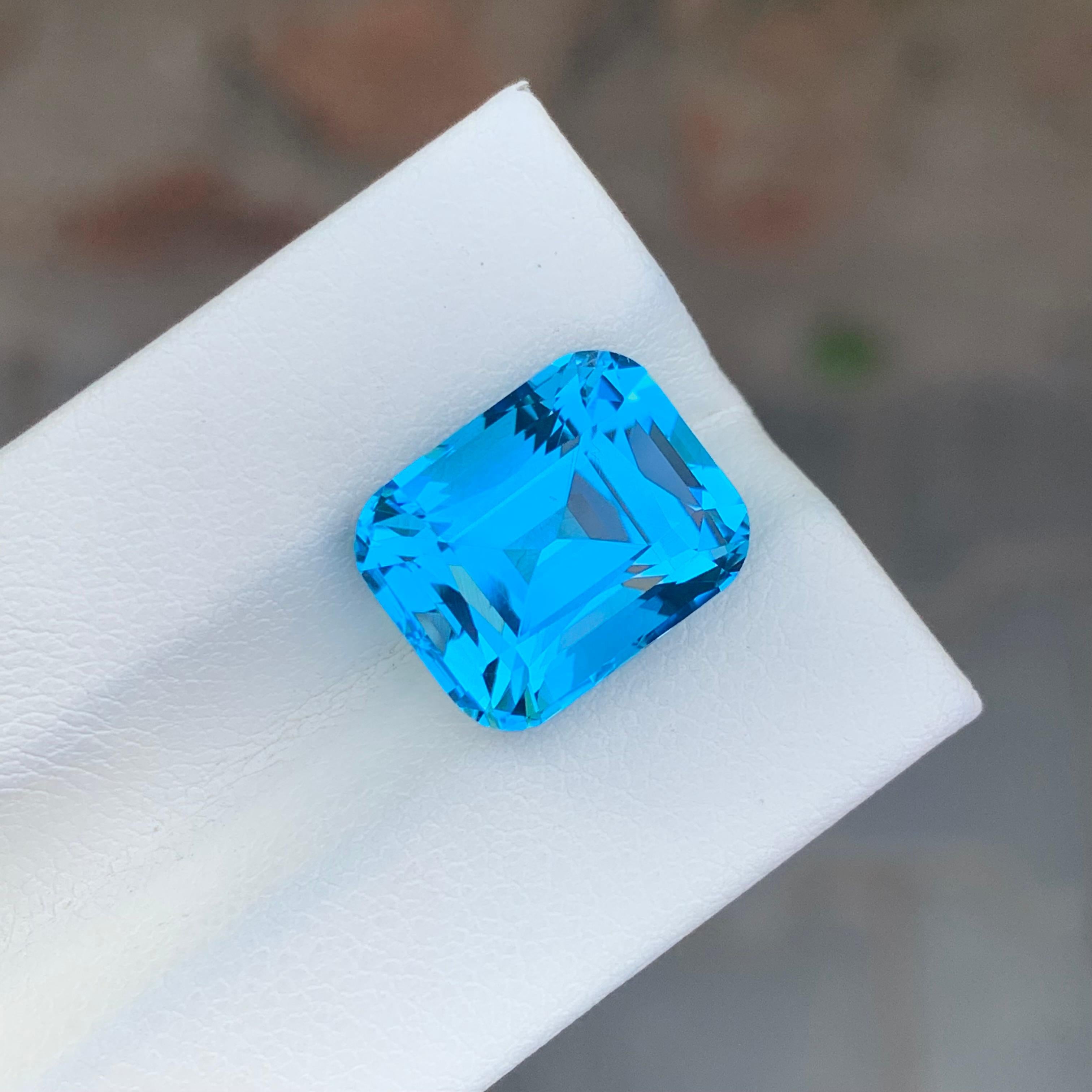 Loose Electric Blue Topaz
Weight: 9.65 Carats
Dimension: 12.8 x 10.3 x 8.5 Mm
Origin: Brazil
Shape: Cushion
Color: Electric Blue
Certificate: On Customer Demand

Benefits Of Wearing Blue Topaz Stone:
It helps to improve communication and