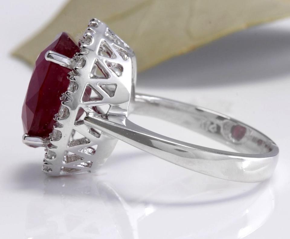 9.65 Carats Impressive Natural Red Ruby and Diamond 14K White Gold Ring

Total Red Ruby Weight is: Approx. 8.75 Carats (Lead Glass Filled)

Ruby Measures: Approx. 13.03 x 10.89 mm

Natural Round Diamonds Weight: Approx. 0.90 Carats (color G-H /