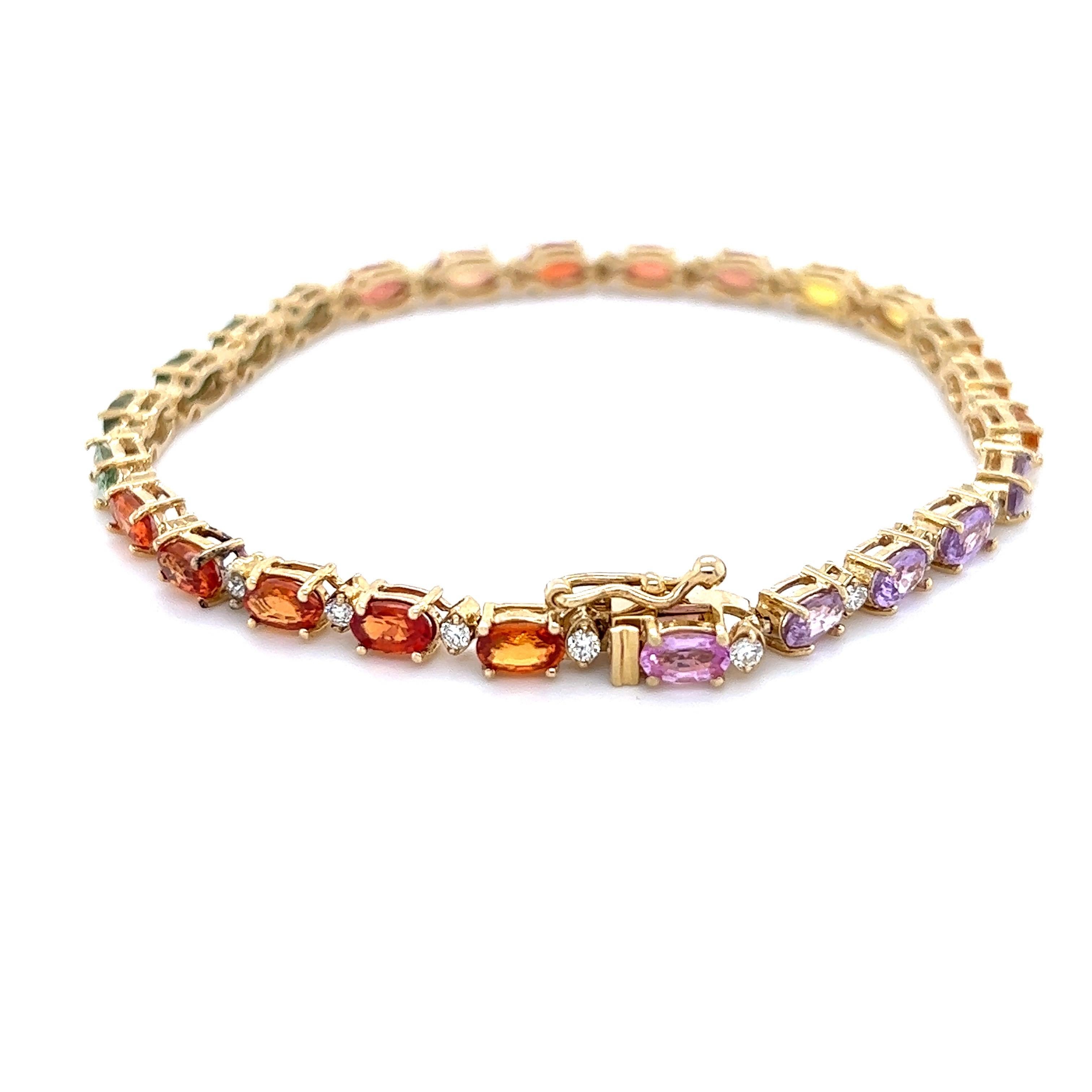 This Bracelet has Natural Oval Cut Multi Sapphires that weigh 9.03 Carats. It also has Natural Round Cut Diamonds that weigh 0.64 Carats. The total carat weight of the bracelet is 9.67 Carats. (Clarity: VS, Color: H)

It is made in 14 Karat Yellow