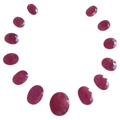 96.75 Carats Ruby Mozambique Oval Faceted Cut stone Layout Heated Natural Gem