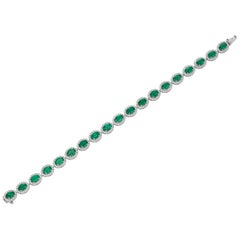 9.69 Carat Oval Emerald Diamond 18 Karat White Gold Bracelet Bangle