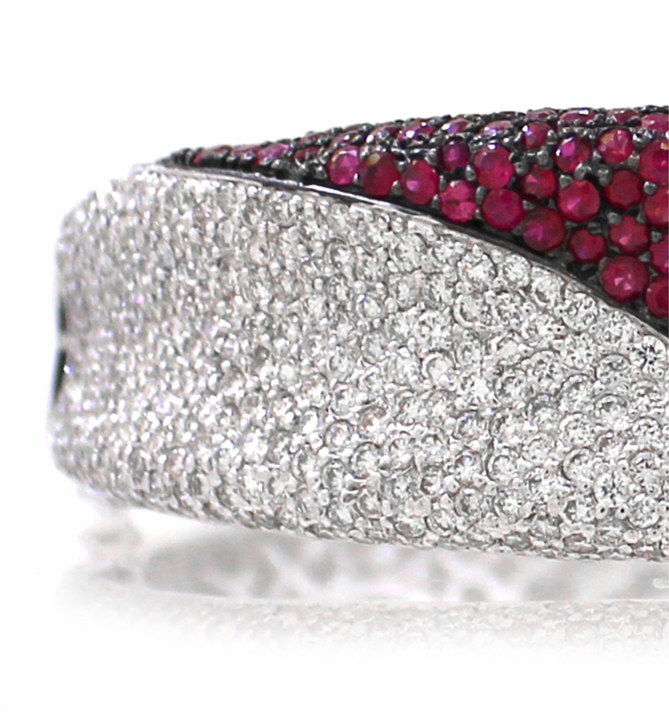 This exquisite bangle is a perfect blend of elegance and sophistication, designed to make a statement at any party or special occasion. Crafted in 18k white gold weighing 45.97 grams, it features 8.57 carats of dazzling round-cut white diamonds,