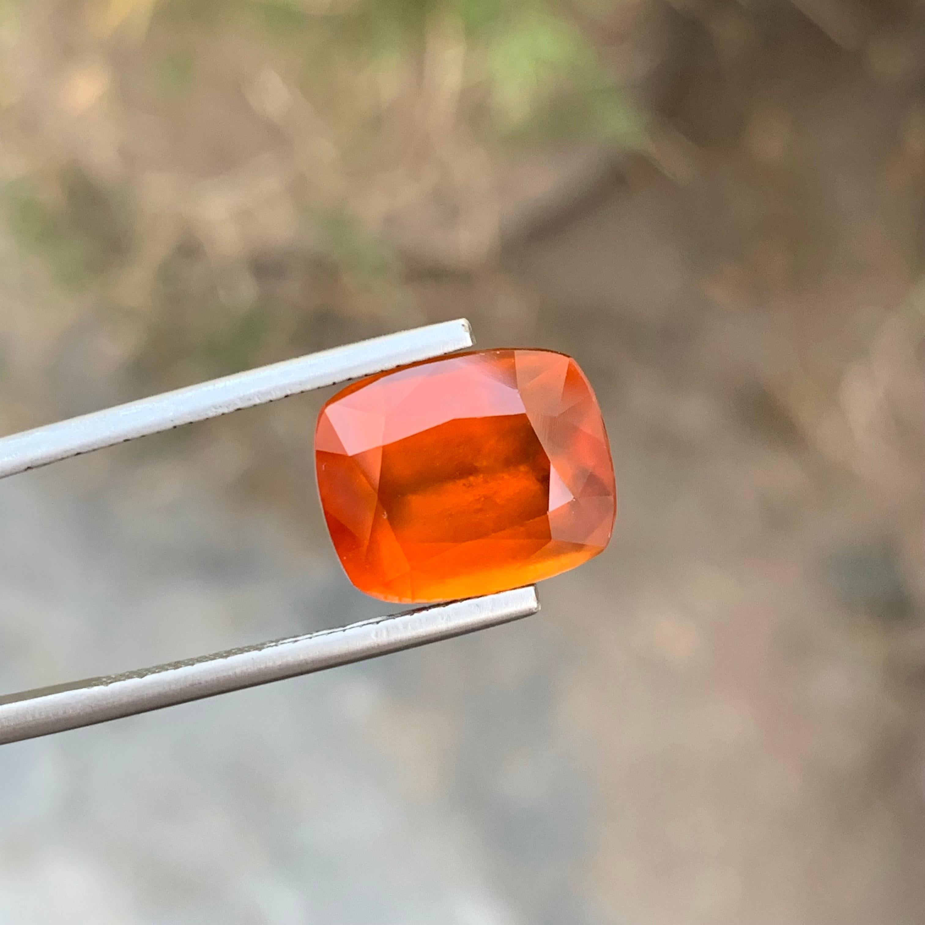 Loose Hessonite Garnet
Weight: 9.70 Carats
Dimension: 13.1 x 10.8 x 7.3 Mm
Colour: Smoky Orange
Cut: Cushion 
Certificate: On Demand

Hessonite garnet, also known as cinnamon stone or gomedh, is a captivating gemstone renowned for its warm hues and