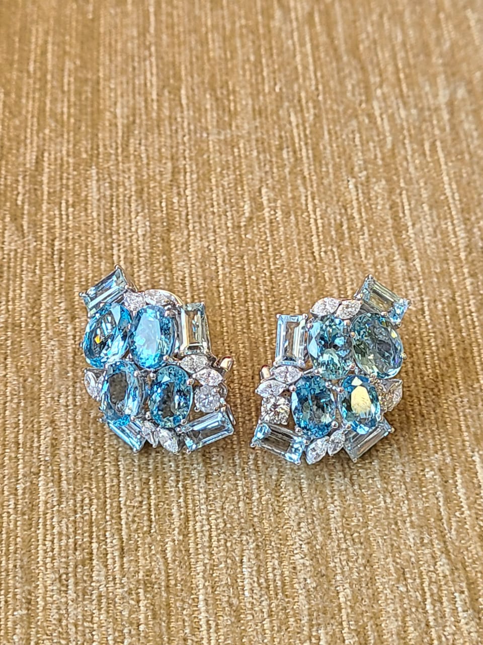 A very beautiful Aquamarine Stud Earrings/ Lever - back Earrings set in 18K Gold & Diamonds. The weight of the Aquamarine is 9.70 carats. The weight of the Diamonds is 1.10 carats. Net Gold weight is 11.08 grams. The dimensions of the earrings are