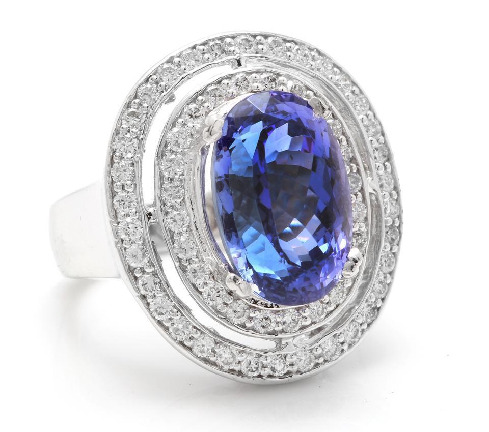 9.70 Carats Natural Very Nice Looking Tanzanite and Diamond 14K Solid White Gold Ring

Total Natural Oval Cut Tanzanite Weight is: Approx. 8.30 Carats

Tanzanite Measures: Approx. 14.50 x 9.60mm

Head of the ring measures: 24.00 x 21.00mm

Natural