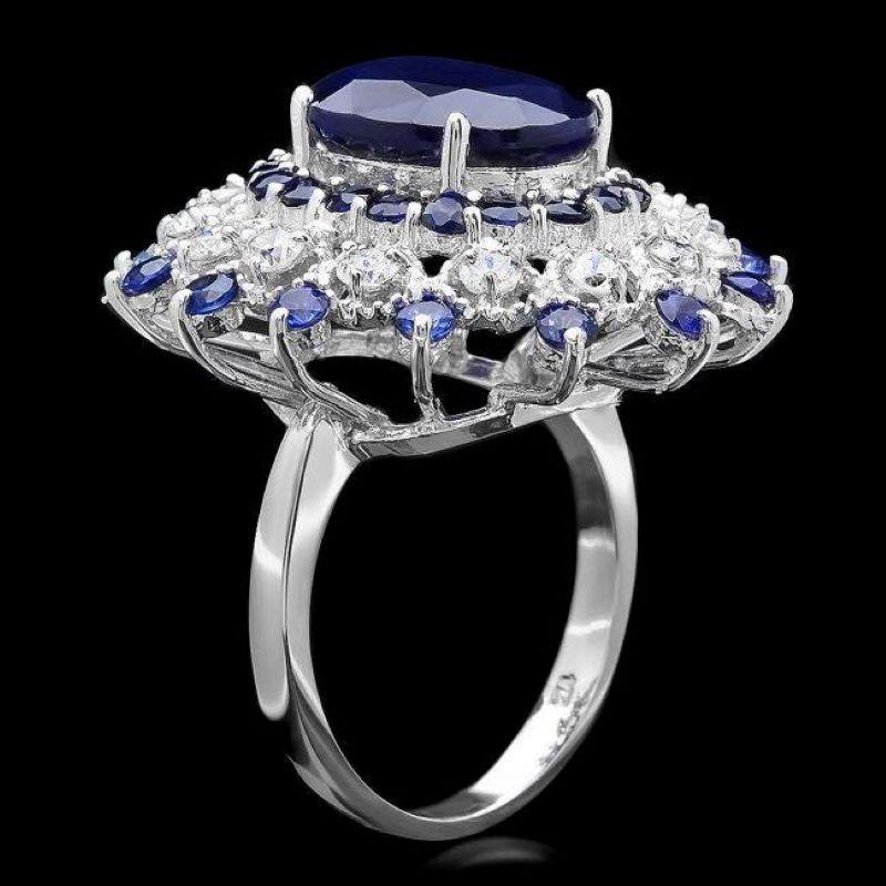 9.70 Carats Exquisite Natural Blue Sapphire and Diamond 14K Solid White Gold Ring

Total Blue Sapphire Weight is: Approx. 8.90 Carats

Sapphire Measures: Approx. 13.00 x 11.00mm (Oval Sapphire) Diffusion Treated

Sapphire Measures: Approx. 2.0 x 2.5