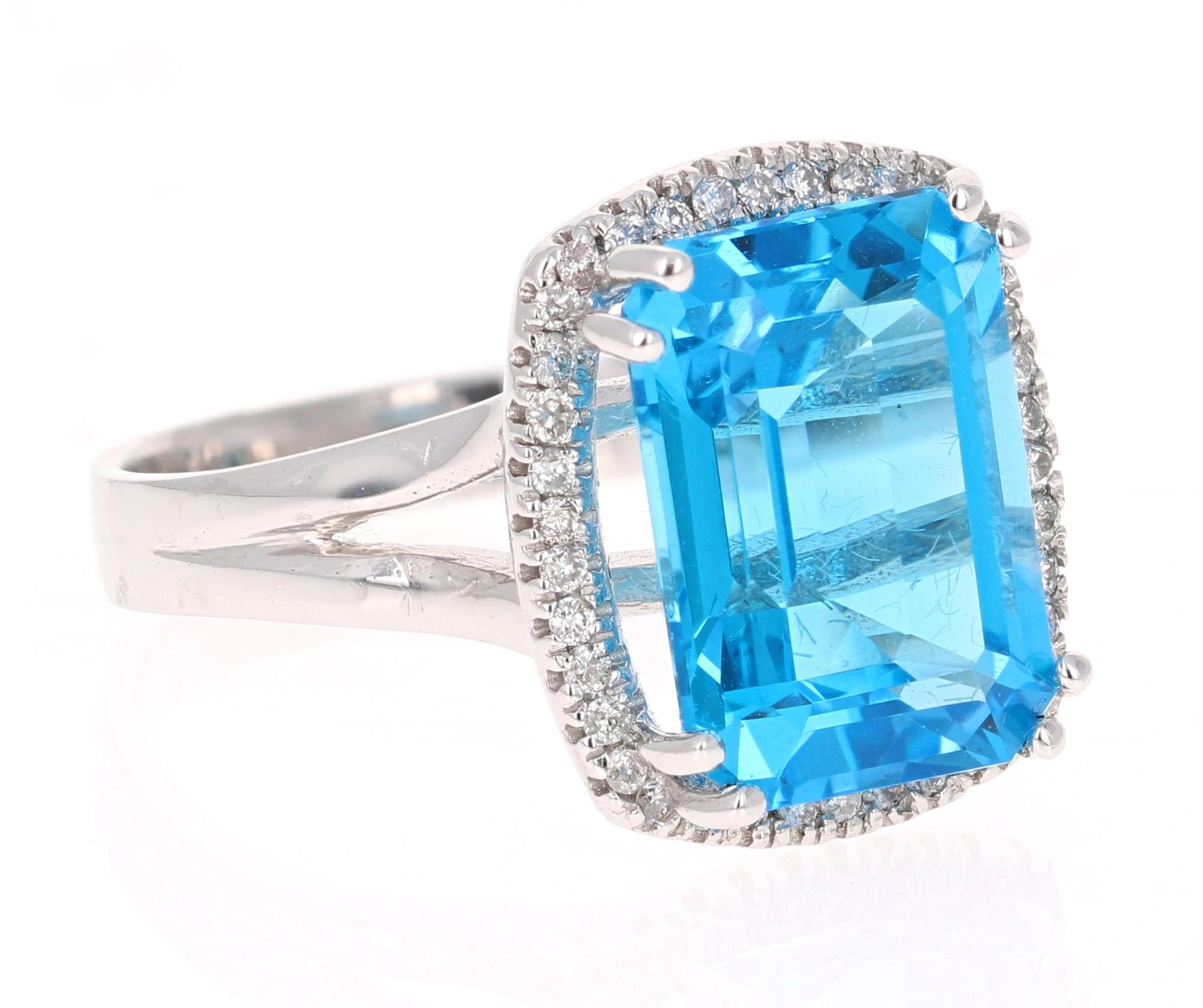 This beautiful Emerald Cut Blue Topaz and Diamond ring has a simple but stunning large Blue Topaz that weighs 9.44 Carats. It is surrounded by 38  Round Cut Diamonds that weigh 0.27 Carats. The total carat weight of the ring is 9.44 Carats. 
The