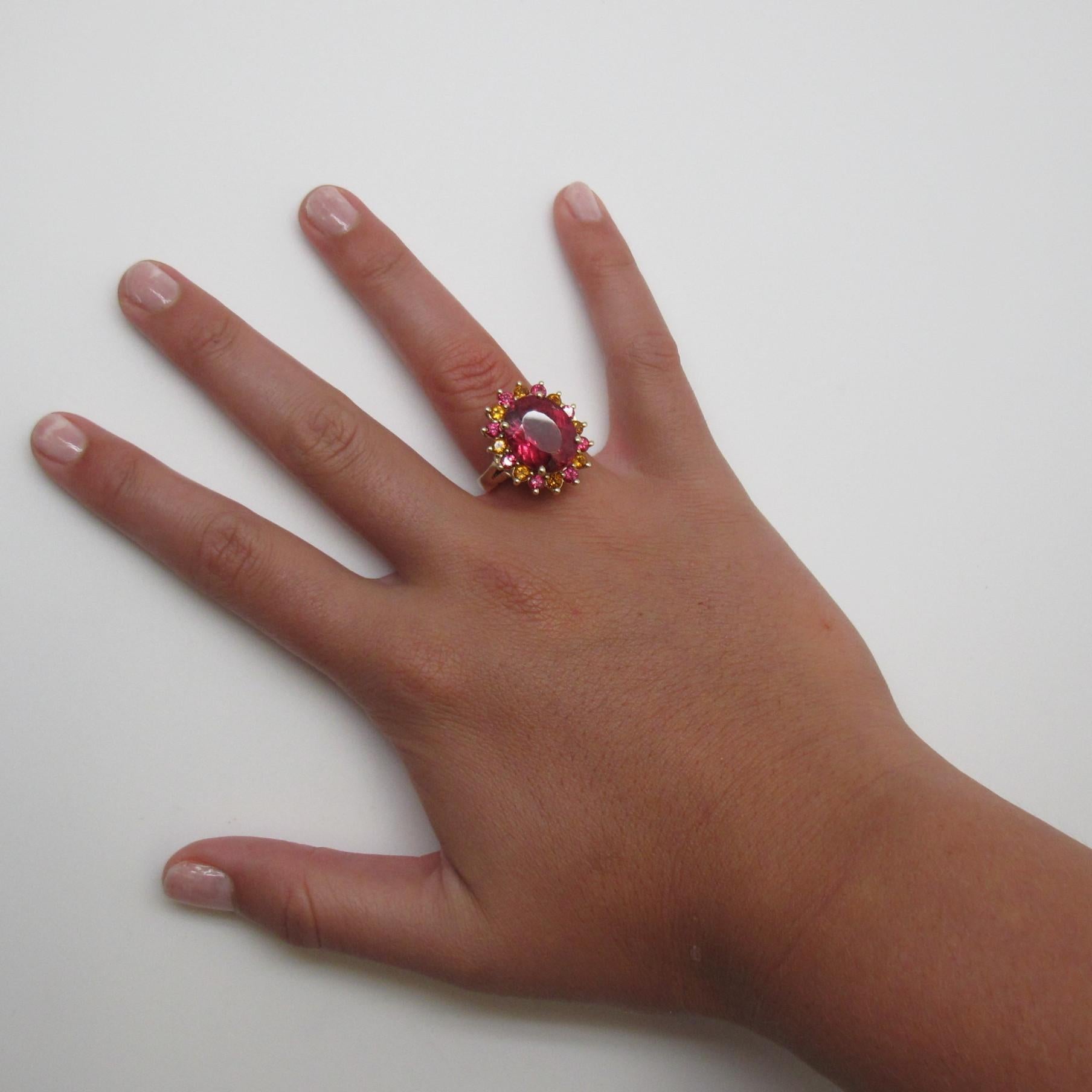 This bold and large cocktail ring is a show stopper! Handcrafted with care in 14k yellow gold, this happy color pairing of gemstones is hard to ignore. It is sure to put a smile on your face!

 A large fucshia- pink tourmaline (16.7x12.9mm/9.71