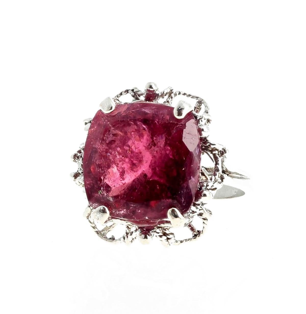 9.71 carats of deep red cushion cut Rubelite Tourmaline (13.4mm x 13.4mm) set in a decorative unique handmade sterling silver ring size 5.5 (sizable).  Spectacular optical effect of the inclusions in the Tourmaline exhibits brilliant reflections and