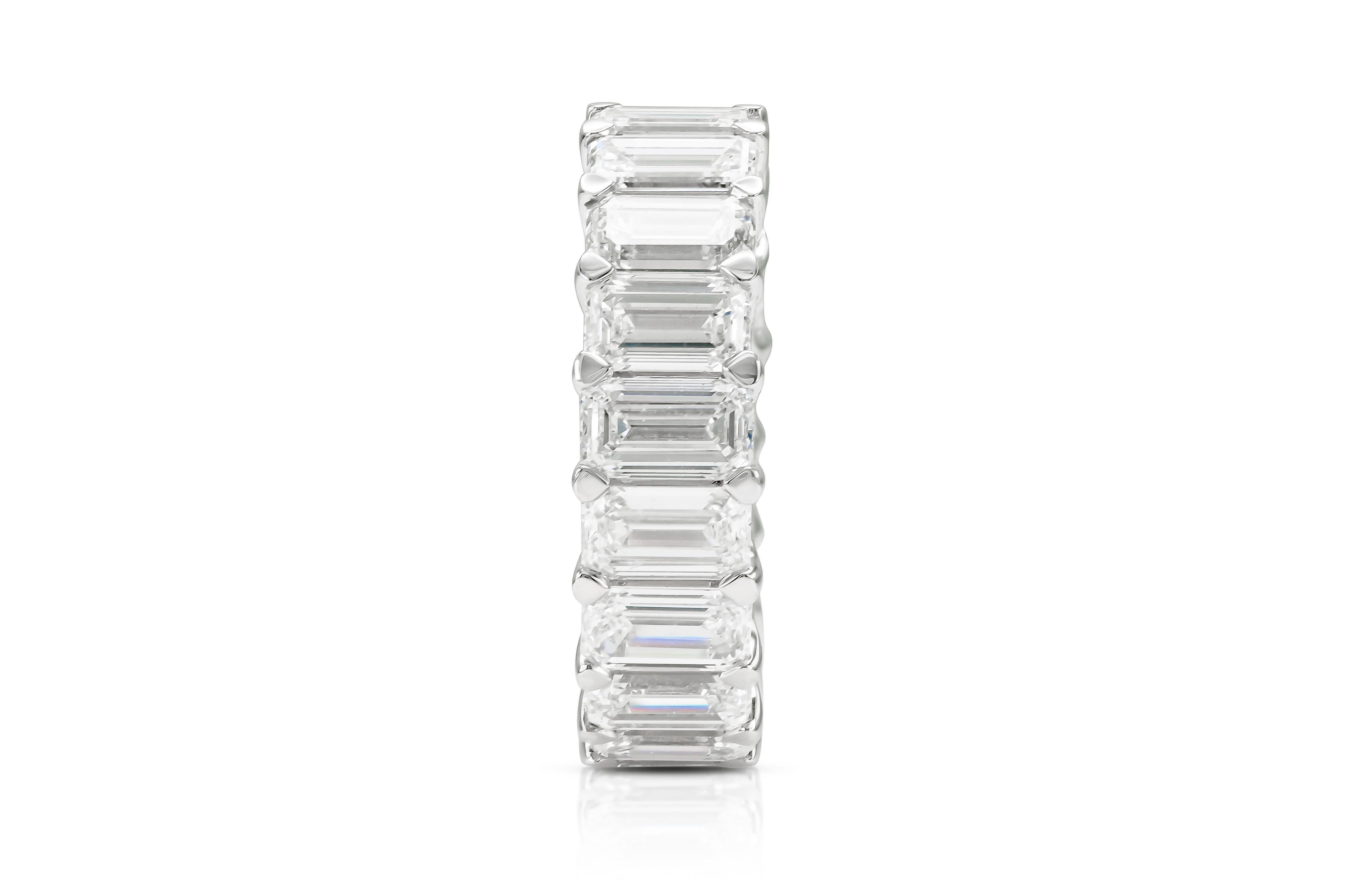 Finely crafted in platinum with 19 Emerald cut Diamonds weighing a total of approximately 9.72 carats, I-J color, VS1-SI clarity.
6 mm wide
Size 6 3/4