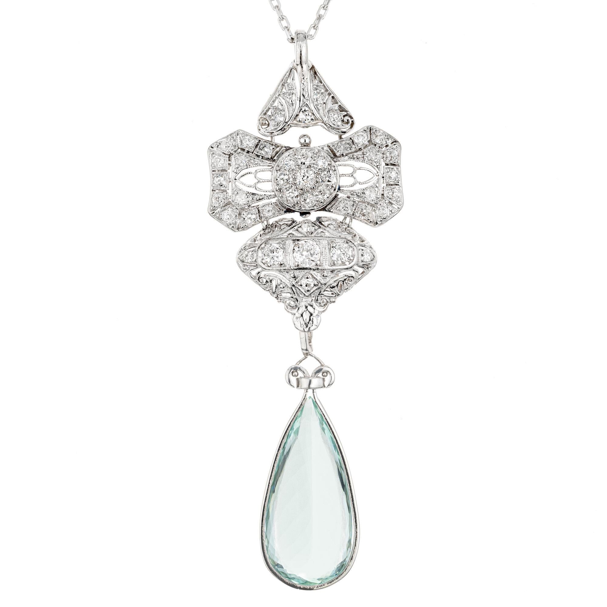 Stunning 1930's Aquamarine and diamond pendant necklace. This spectacular Art Deco filigree pendant begins with a pear shaped 9.75cts bezel set aqua which dangles at the bottom of a platinum pendant that consists of platinum handmade pendant with 43