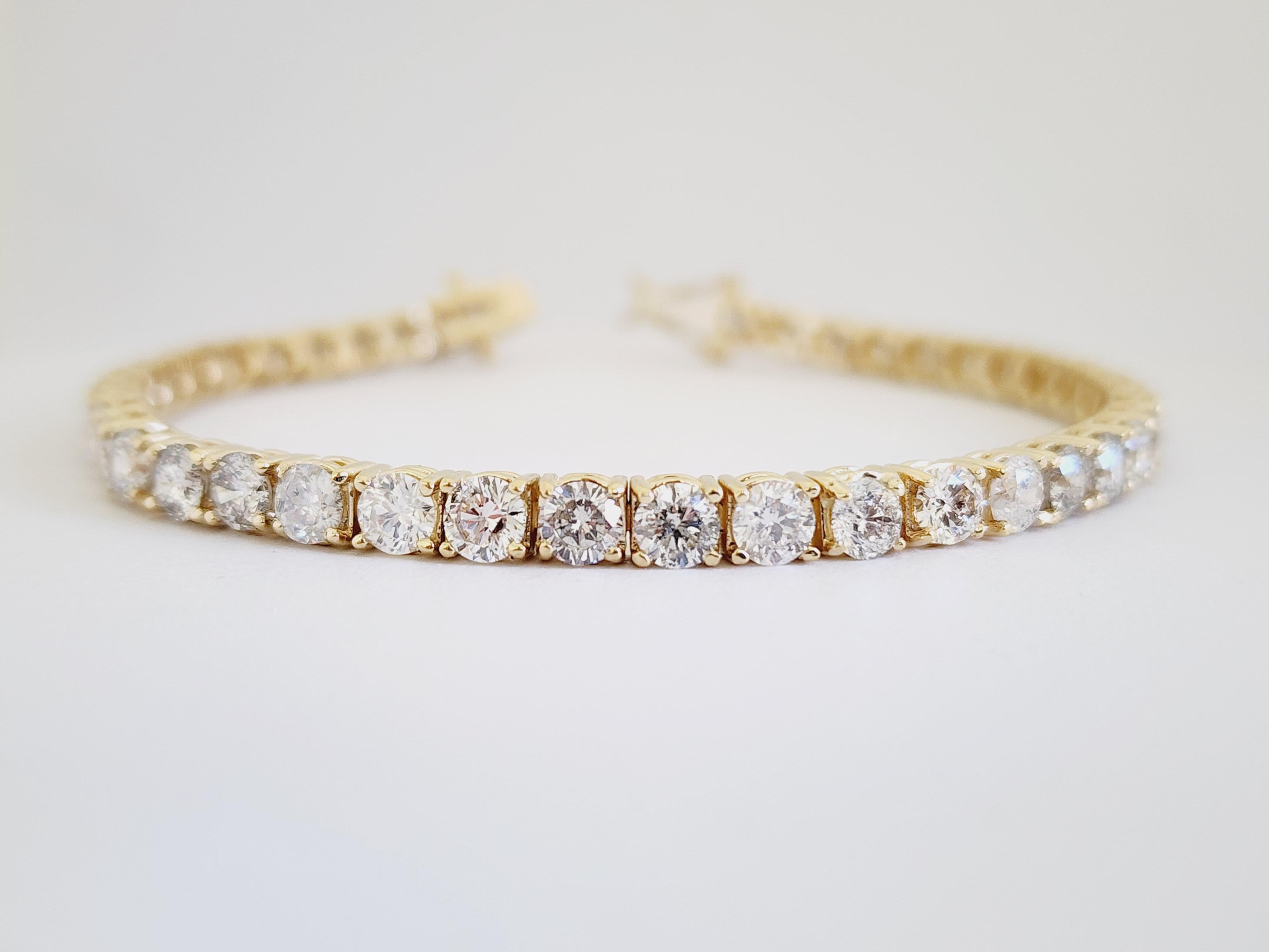 9.77 Carat Natural diamonds tennis bracelet round-brilliant cut  14k yellow gold. 
7 inch. Average Color F-G, Clarity SI-I. 3.9 mm wide. Very Shiny.

*Free shipping within the U.S.*