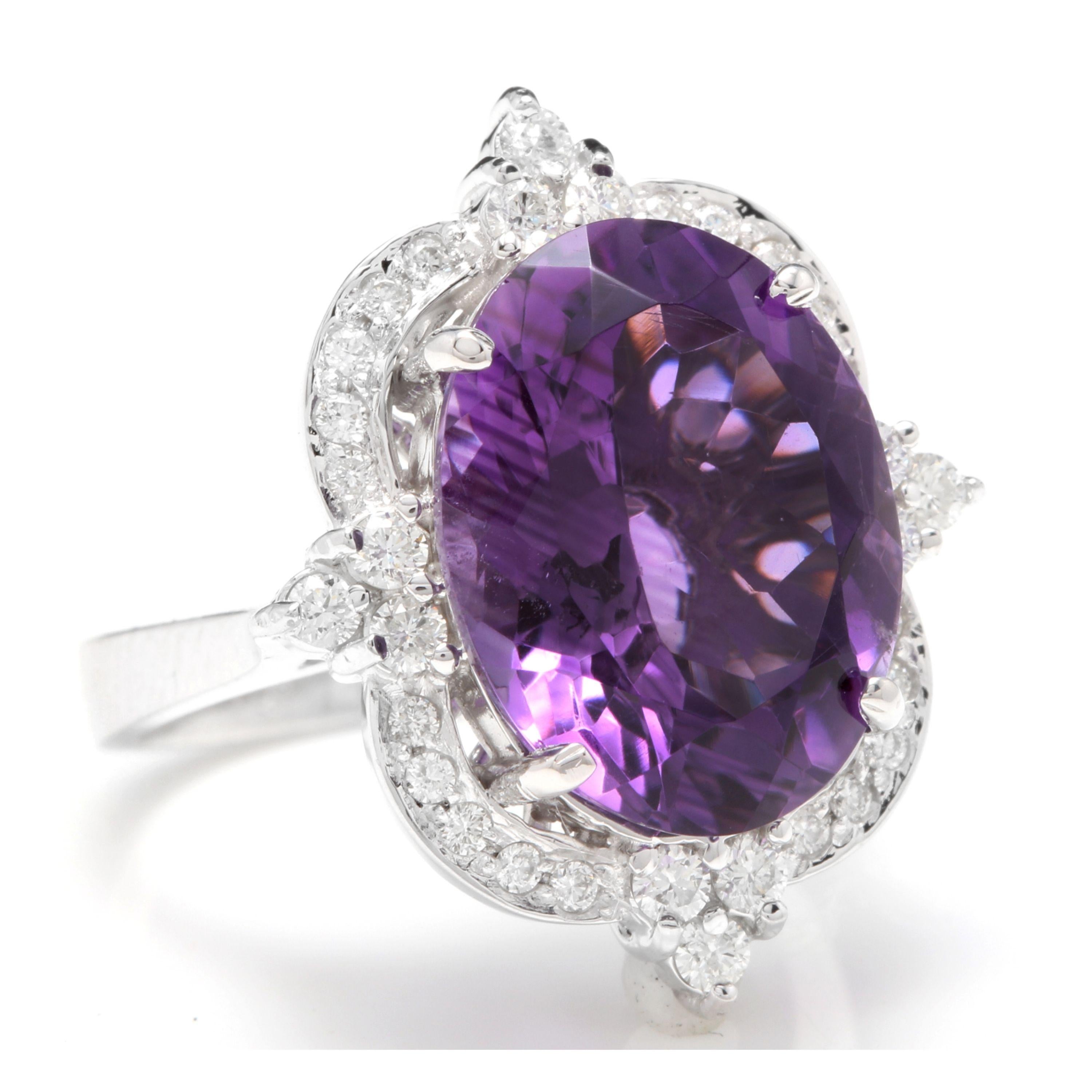 9.75 Carats Natural Impressive Amethyst and Diamond 14K Solid White Gold Ring

Total Natural Oval Amethyst Weight is: Approx. 9.00 Carats

Amethyst Measures: Approx. 16 x 12mm

Natural Round Diamonds Weight: Approx. 0.75 Carats (color G-H / Clarity