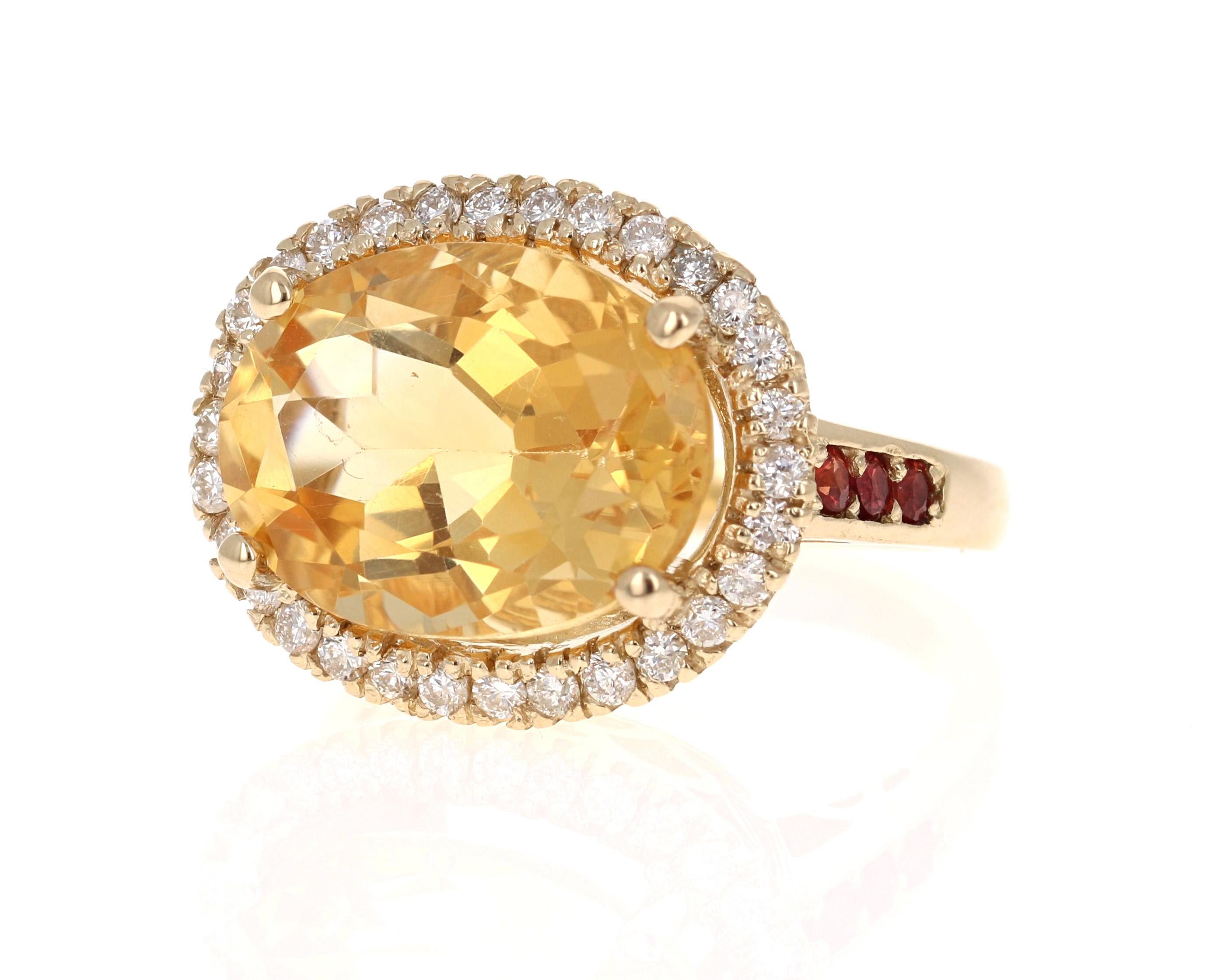 A Stunning and uniquely designed beauty to say the least! 

This magnificent ring has a bold Oval Cut Citrine that is blazing yellow! It weighs 8.89 Carats and is surrounded by a beautiful halo of 30 Round Cut Diamonds that weigh 0.57 Carats.