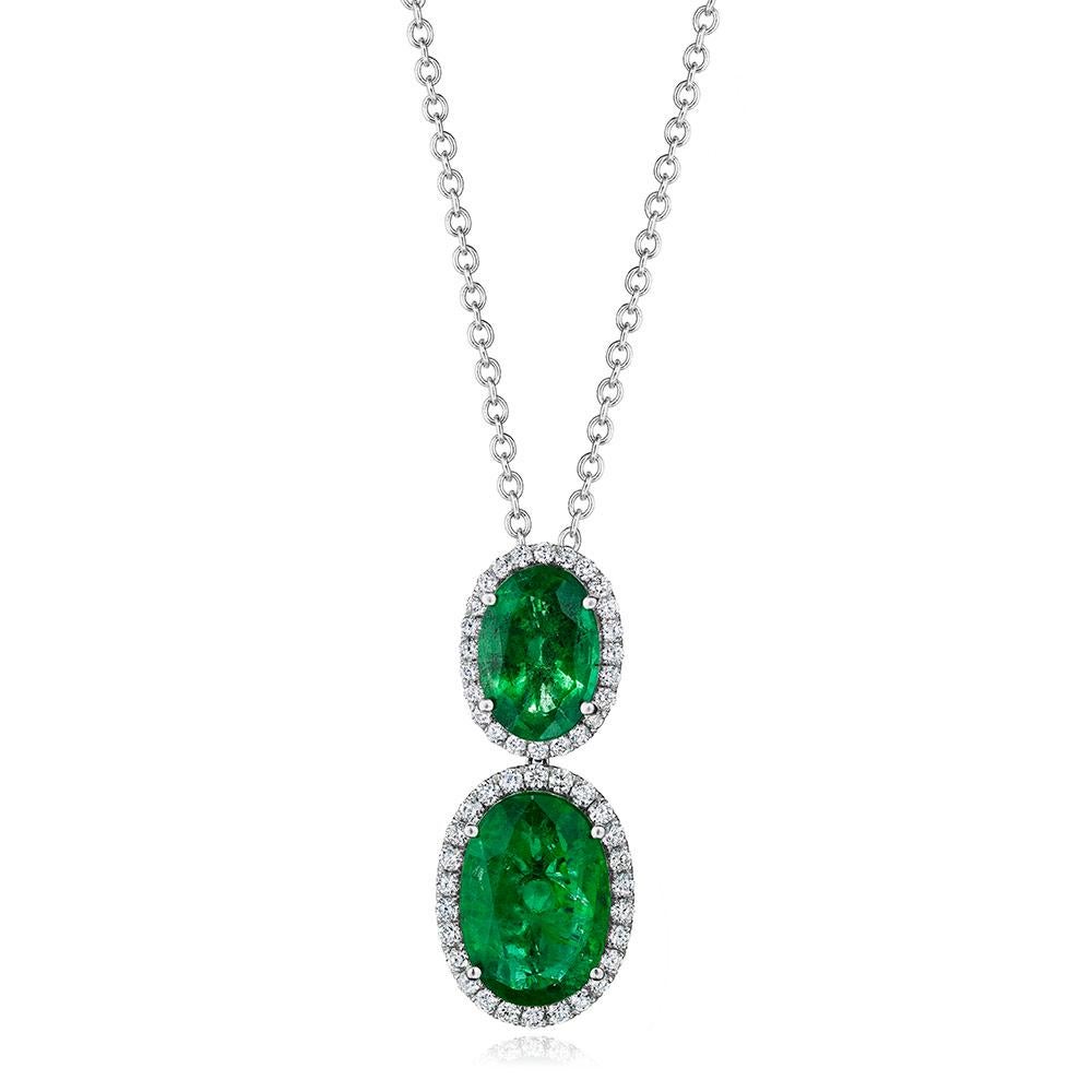 •	18KT White Gold
•	Carat Weight: 9.76ctw

•	Number of Oval Emeralds: 2
•	Carat Weight: 8.93ctw

•	Number of Round Diamonds: 50
•	Carat Weight: 0.83ctw

•	2 beautiful dark green oval cut emeralds are surrounded by halos made of round brilliant cut