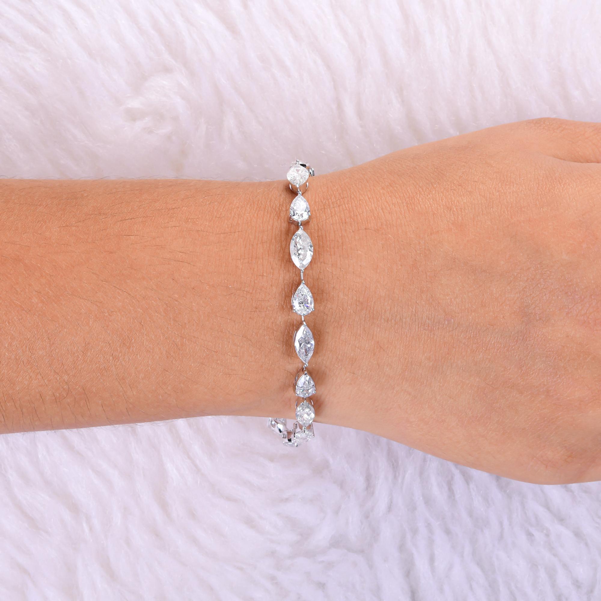 9,76 quilates SI/H Marquesa de diamantes Pera Pulsera de aniversario Oro blanco 14 quilates
La pulsera presenta una impresionante secuencia de diamantes pera y marquesa, cada uno meticulosamente engastado para crear una fluida y radiante línea de