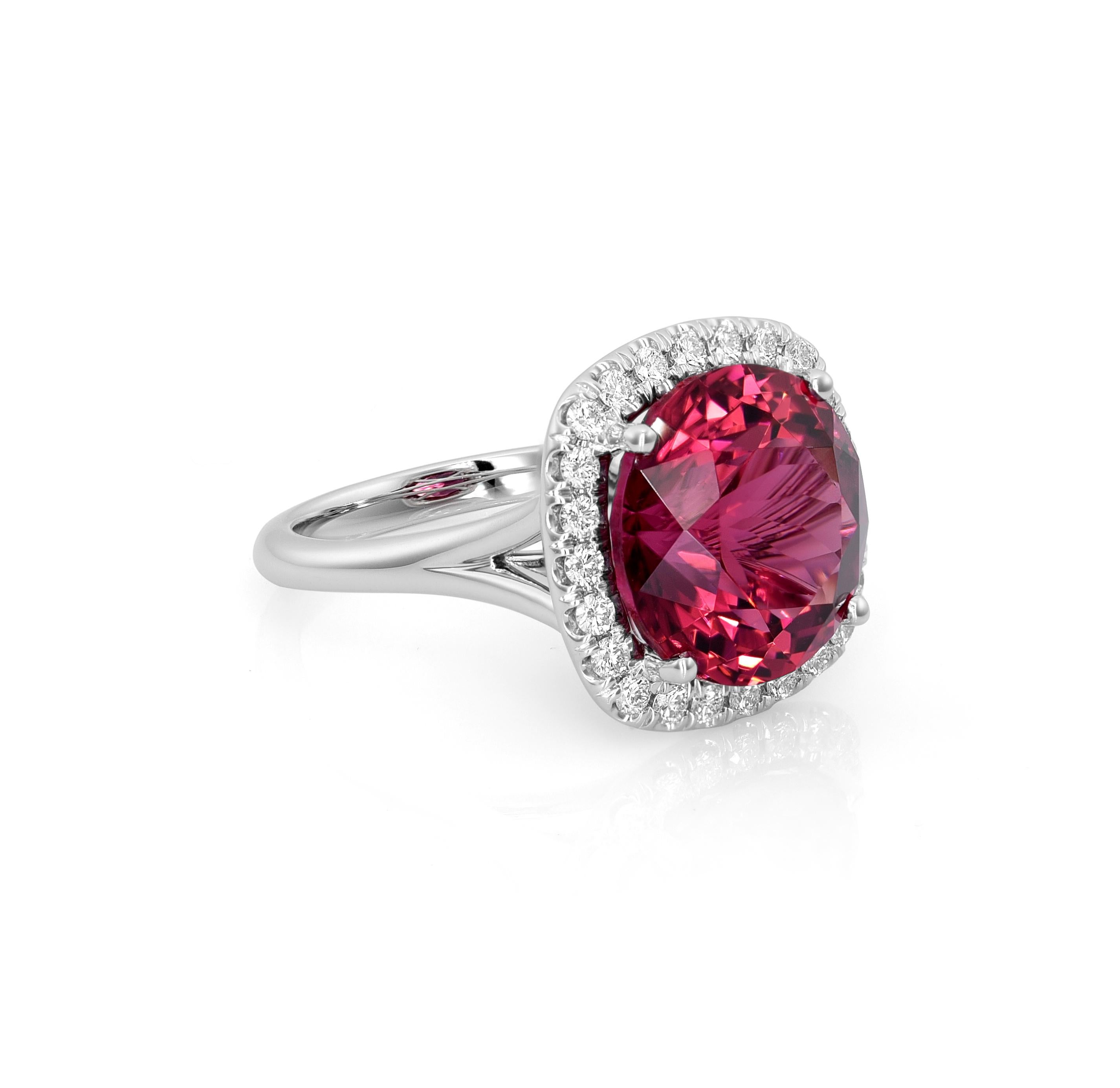 This exquisite jewelry piece boasts a captivating Natural Red Tourmaline gemstone, perfectly round and generously sized at 9.77 carats. With dimensions of 13.30 x 13.31 x 8.37 mm, the gemstone is showcased in a luxurious setting crafted from 14K