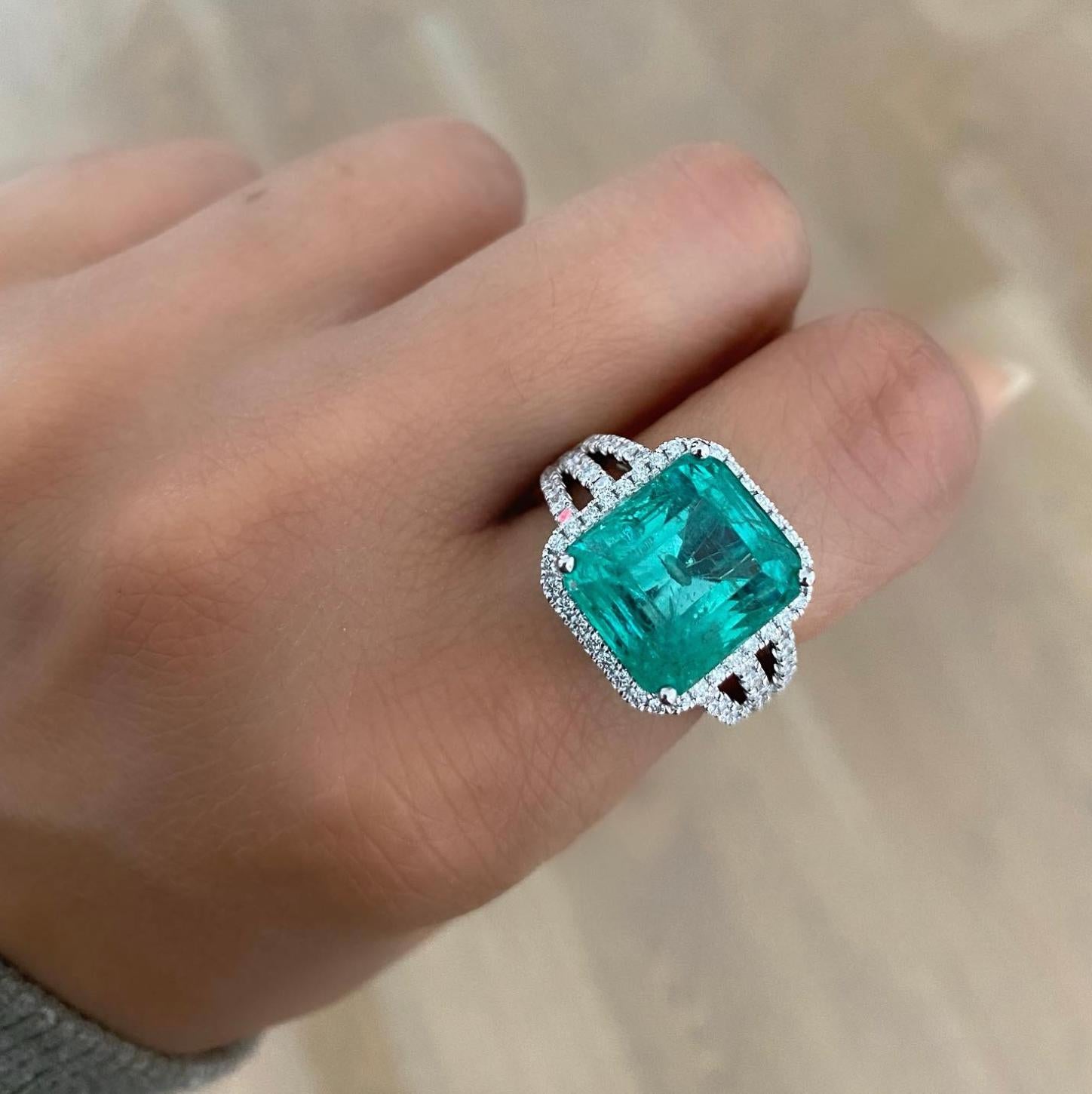 Make a statement with this significant Emerald of almost 10 cts featured in a trinity style brilliant cut diamond ring. Renowned for our one-of-a-kind precious gemstone collection, this ring is the star of our holiday collection!  Wear it as a