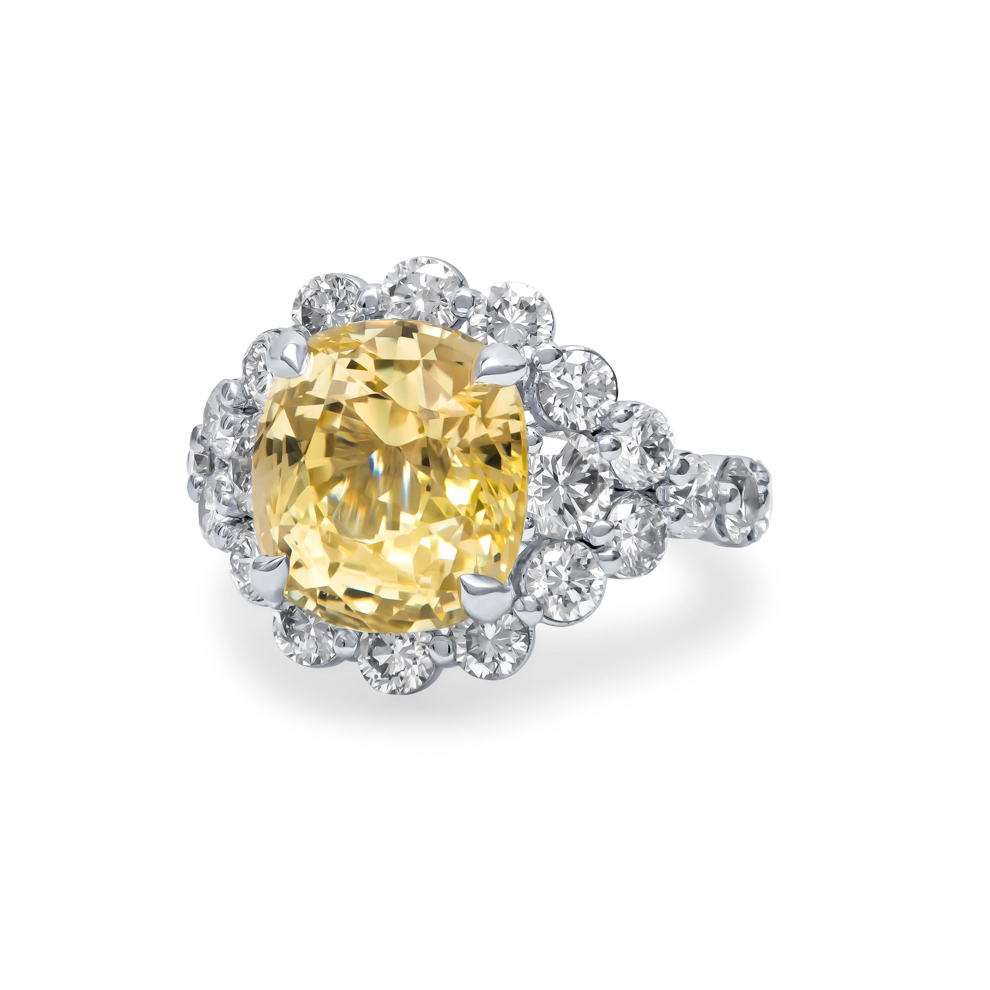 Beautifully hand-crafted 9.79 carat cushion cut natural Ceylon, no heat, yellow sapphire center stone that is set in a custom platinum setting. The stone is accompanied by approximately 3.40 carats total weight of fine round brilliant cut natural