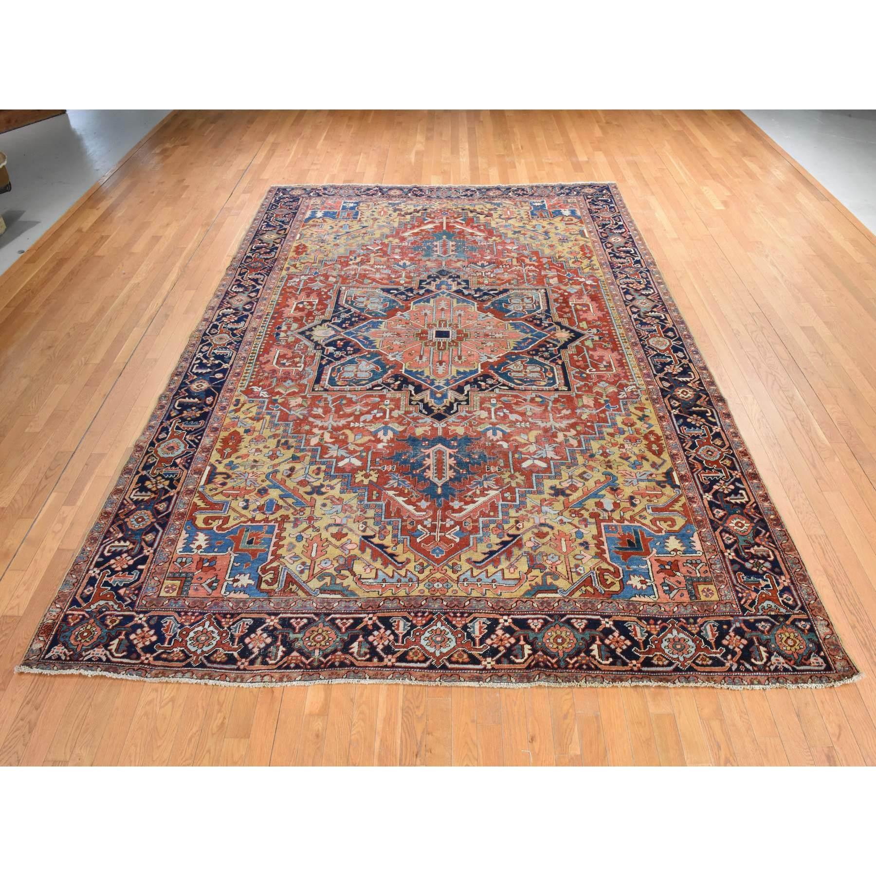 Savvy Red, Antique Persian Heriz with Camel Gold Color Corners, Even Wear, Good Condition and Clean, 100% Wool, Hand Knotted, Oriental Rug
Primary materials: Wool
Latex: No Pile 
height: 0.25 Inches
Style: Traditional
Primary color: Red
Secondary