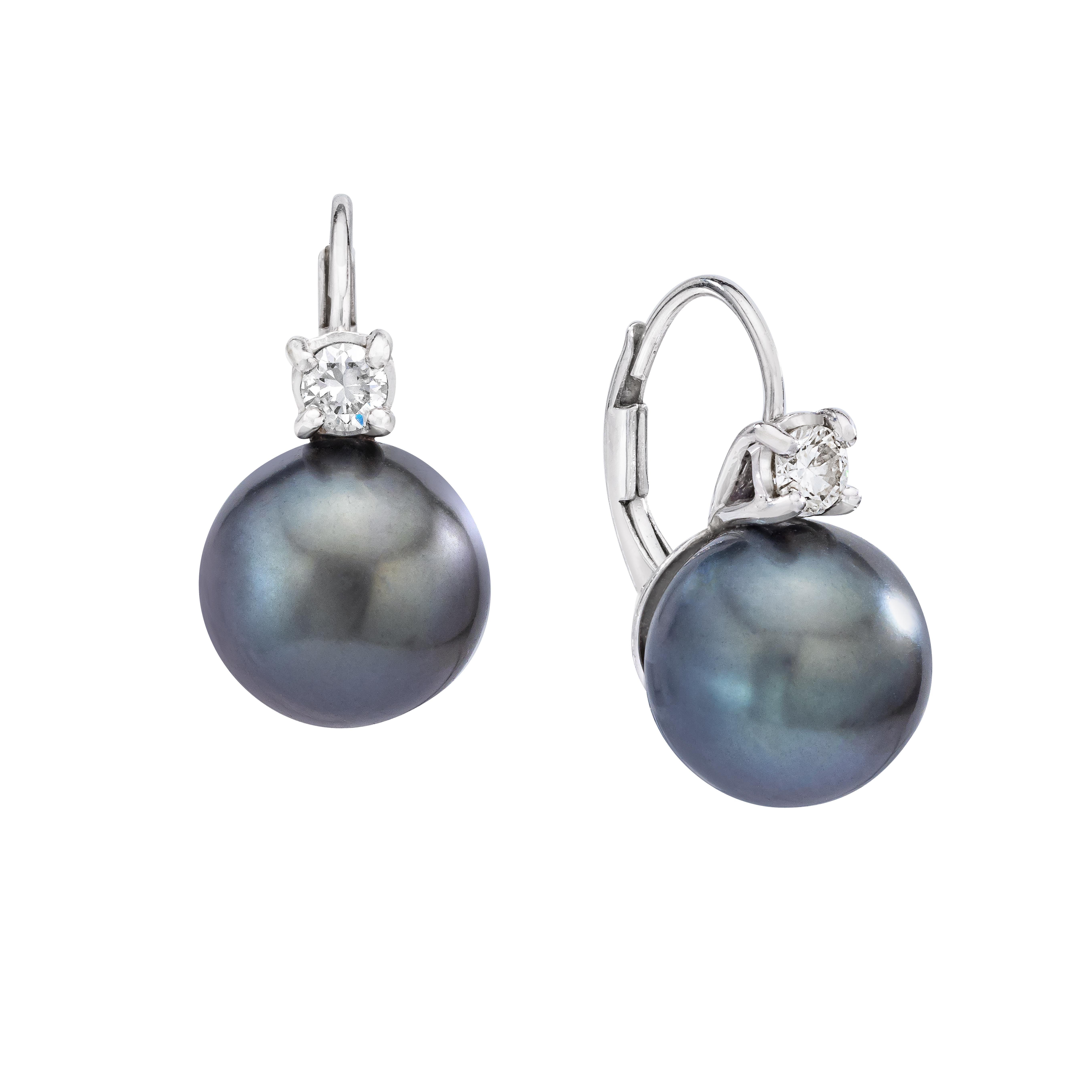 Beautiful and versatile Tahitian Pearl and Diamond lever back earrings.

Earring Details

(2) 9.8 - 10 mm Tahitian Pearl Earrings - Gray Overtone
(2) Round Brilliant Diamonds - Weighing approximately 0.20 Carats

Overall Weight:  4.2 grams

Overal
