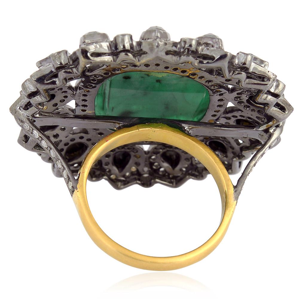 This ring has been meticulously crafted from 18-karat gold & sterling silver with blackened finish. Handcrafted in 9.8 carat emerald, 1.9 carat spinel & 1.73 carat diamond. 

The ring is a size 7 and may be resized to larger or smaller upon request.