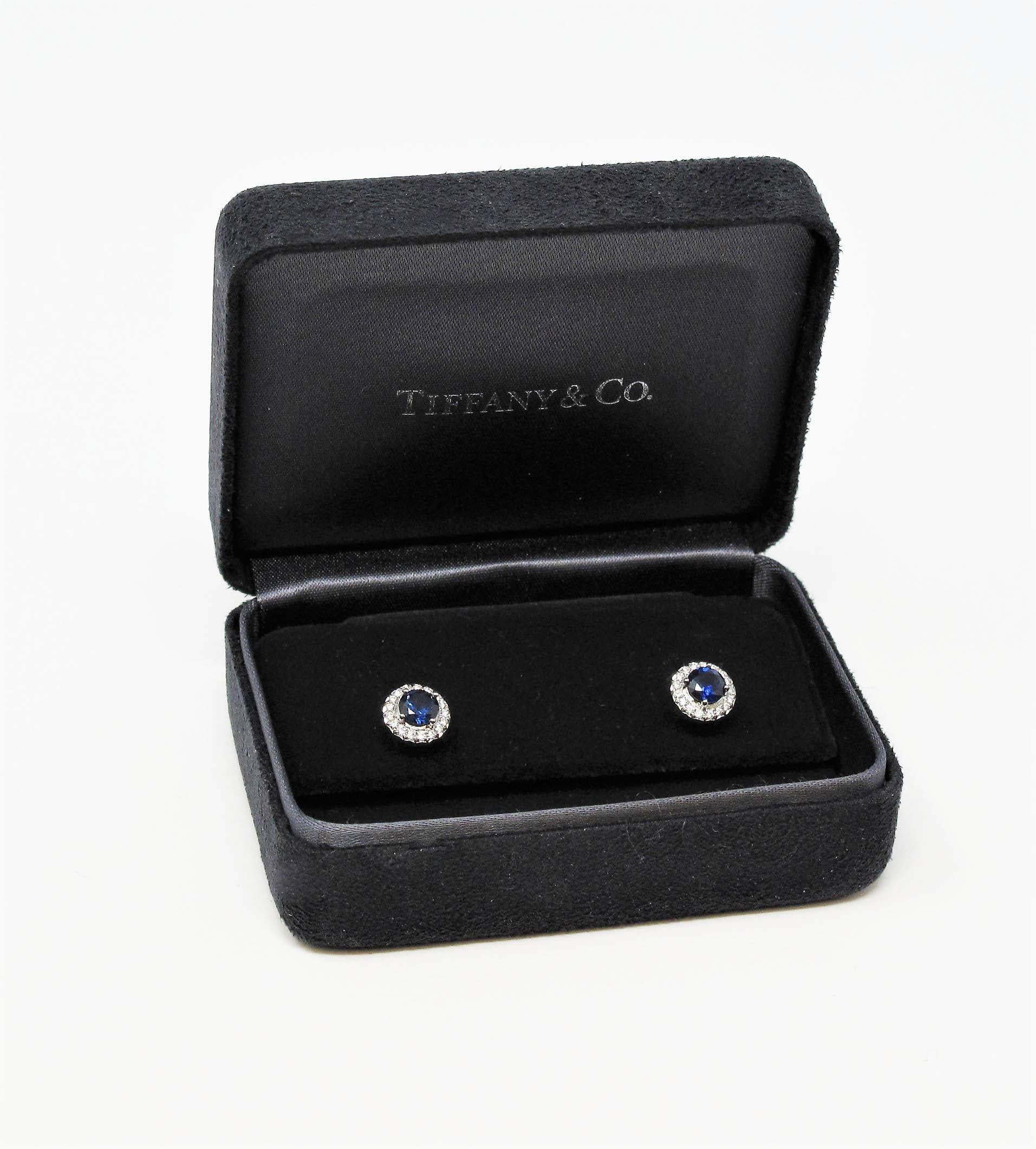 Gorgeous sapphire and diamond stud earrings with a sophisticated modern twist. These gorgeous diamond halo studs offer substantial sparkle and glamour without being over the top, while their simple yet elegant design can be worn with just about