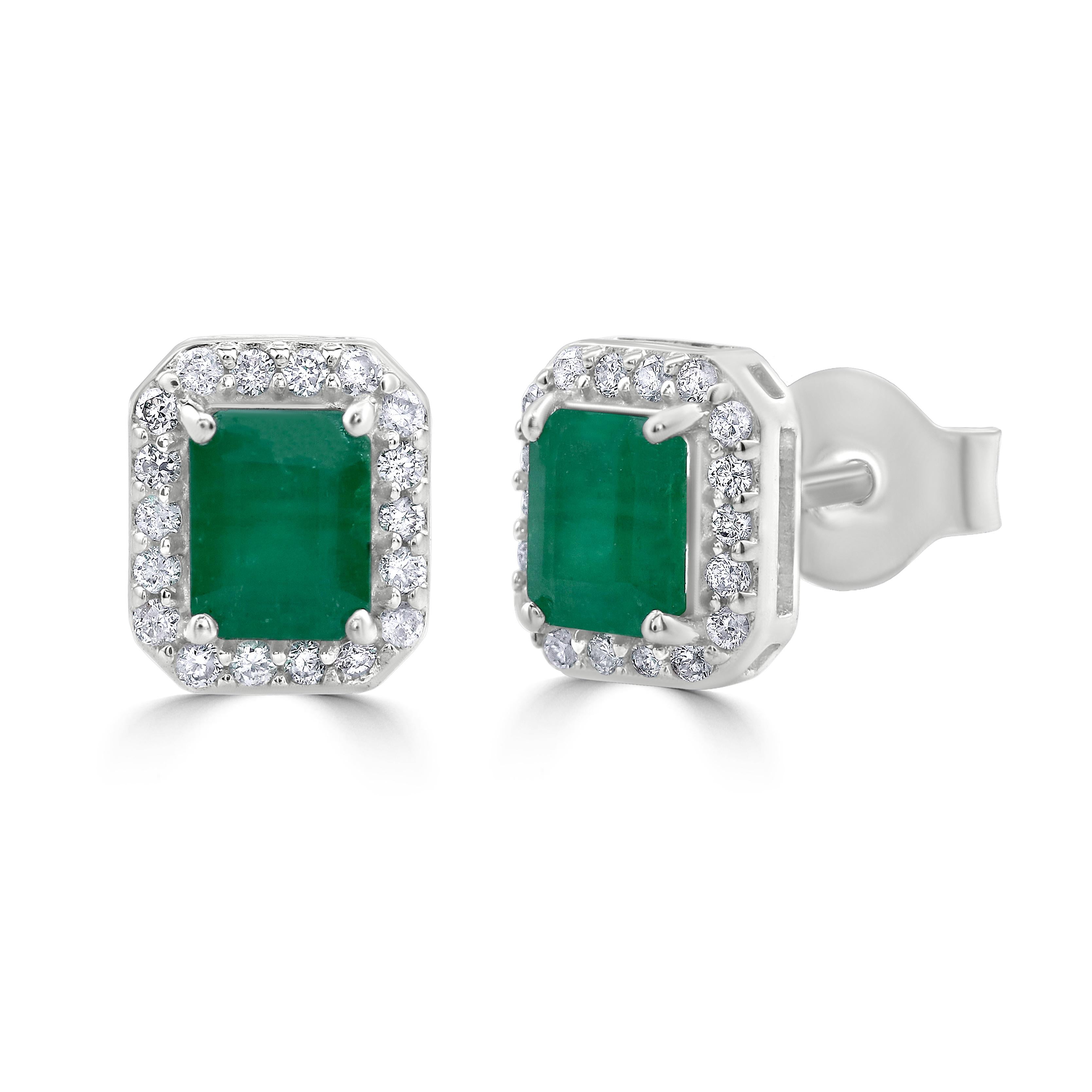 Some of the world's most desirable gemstones come together for this gemstone earring ! These Gemistry stud earrings boast of .98 carat octagon emerald at the center in four prongs accentuated by a halo of round and brilliant cut diamonds, prong set