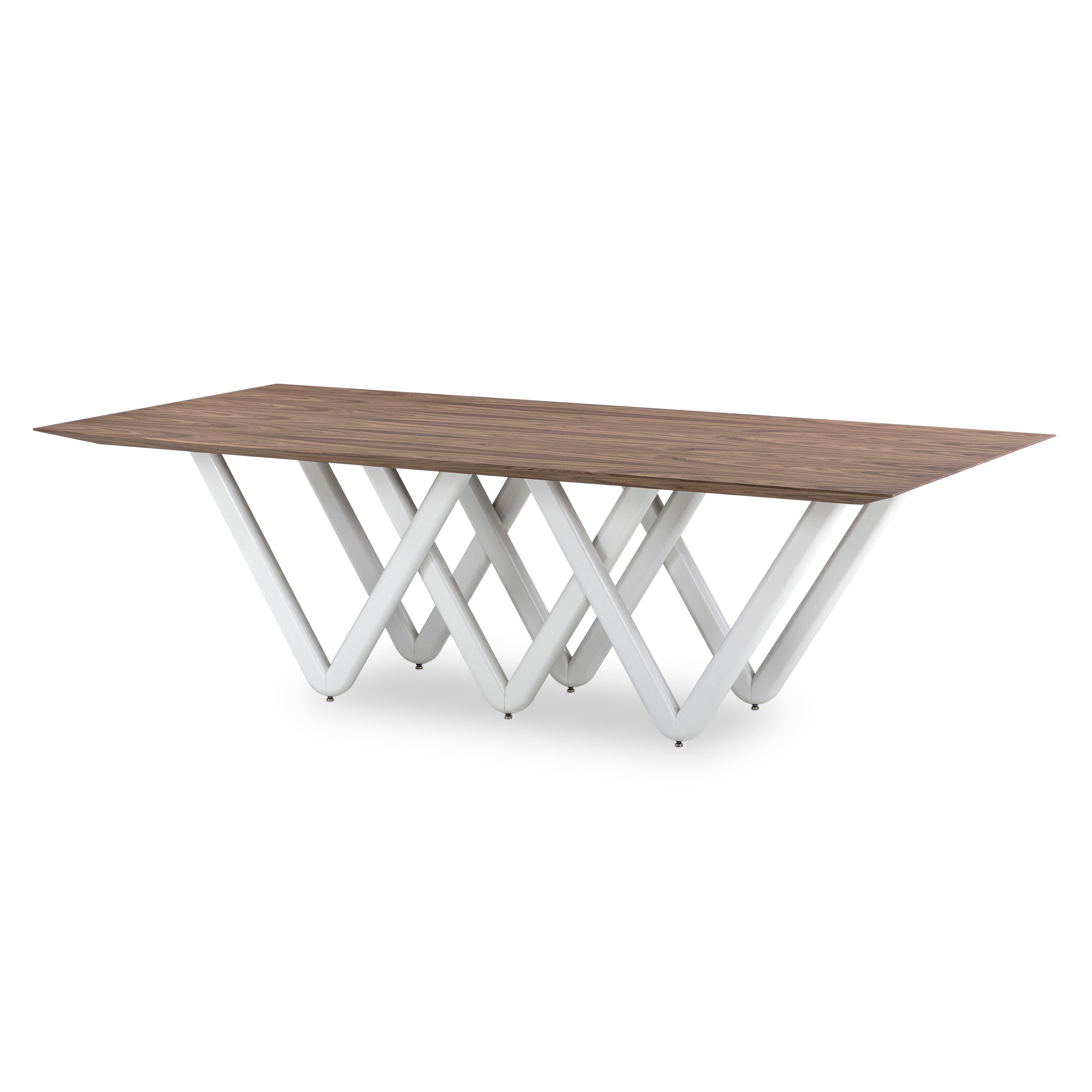 The Dablio dining table features a white-painted intersecting V-shaped base that is highlighted by a stunning Walnut veneered tabletop. It has a very singular and original structure and at the same time, it is a very simple but modern dining table.
