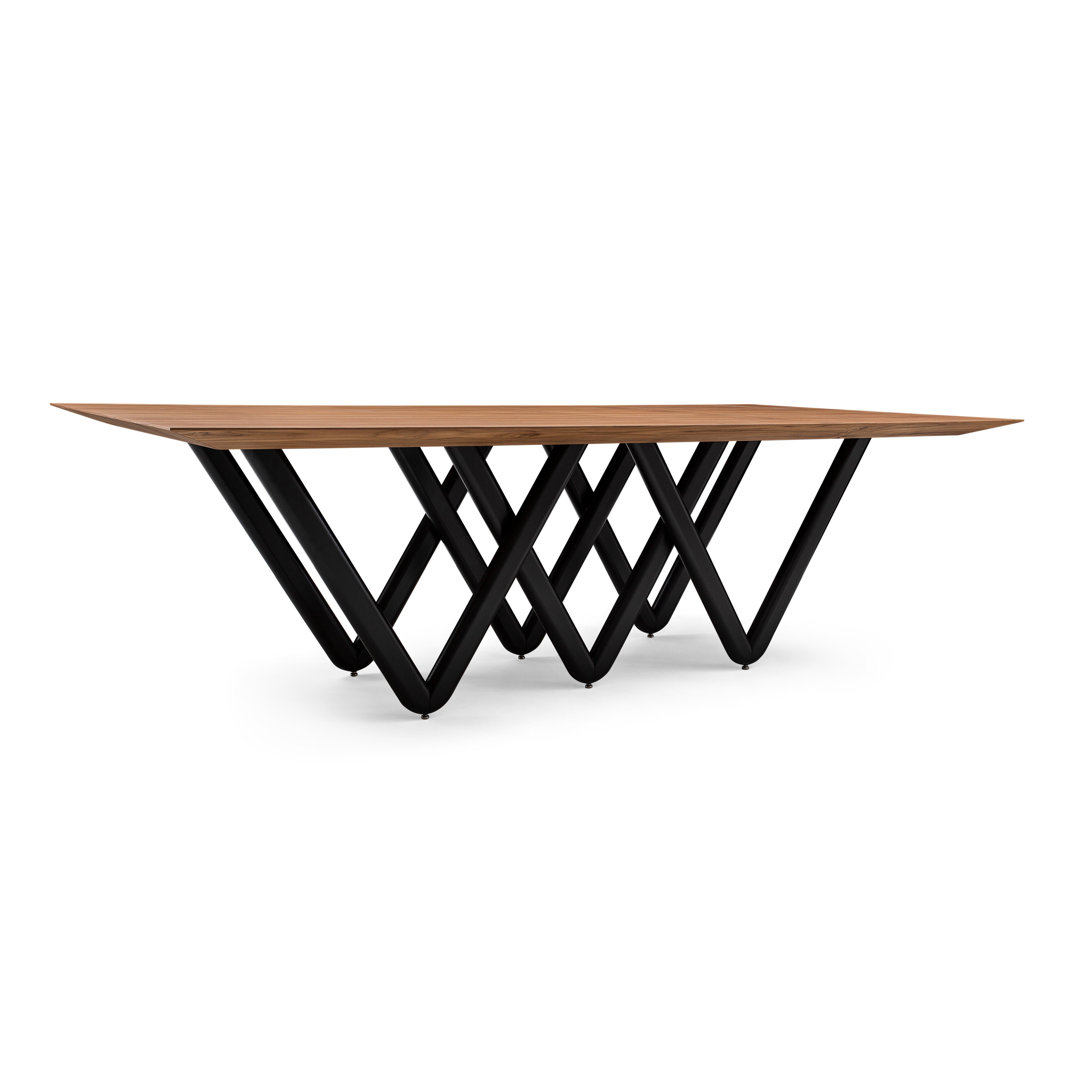The Dablio dining table features a white-painted intersecting V-shaped base that is highlighted by a stunning Walnut veneered tabletop. It has a very singular and original structure and at the same time, it is a very simple but modern dining table.