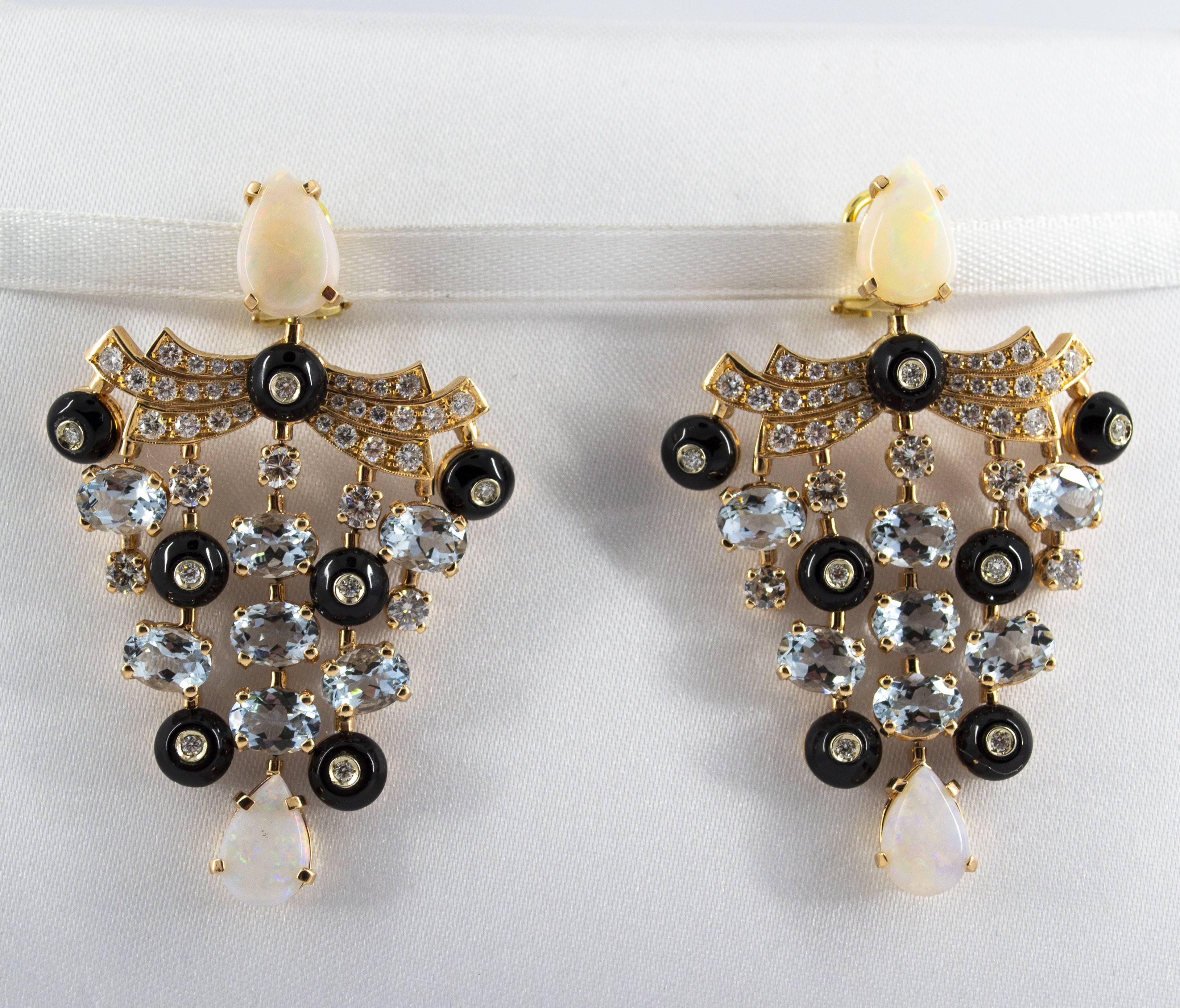 These Clip-On Earrings are made of 14K Yellow Gold.
These Earrings have 2.81 Carats of Diamonds.
These Earrings have 9.80 Carats of Aquamarine.
These Earrings have also 5.22 Carats of Opal.
All our Earrings have pins for pierced ears but we can