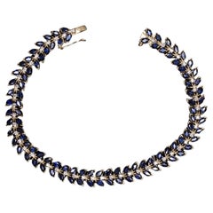 9.80  Bracciale in oro con zaffiro blu e diamanti