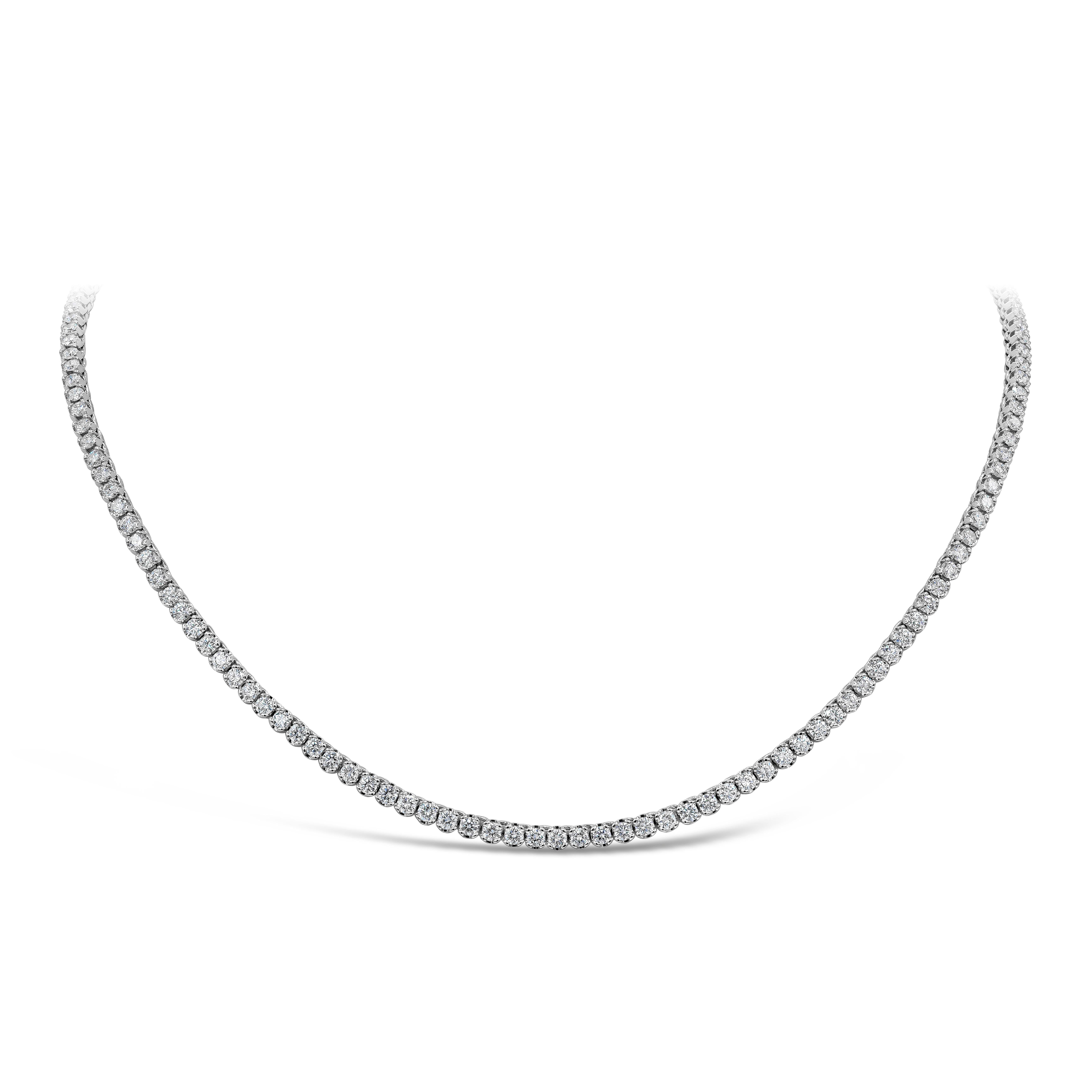 A versatile piece of jewelry, showcasing a row of round brilliant cut diamonds weighing 9.80 carats total with F color and VS-SI1 clarity. Set on a classic four prong setting made of 18K white gold. This tennis necklace is 17.5 inches in length.
