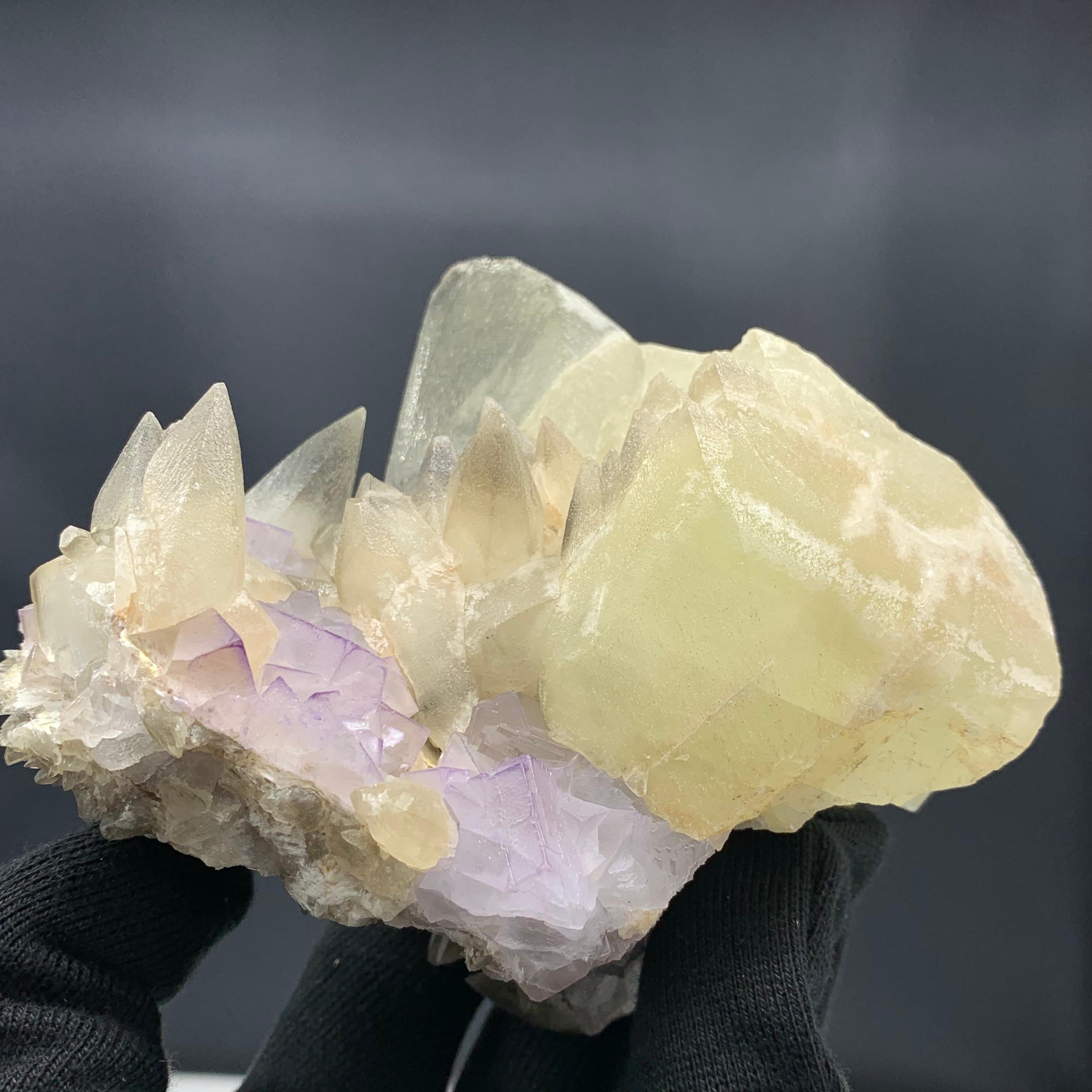 Glorious Calcite With Florite Bunch From Balochistan, Pakistan 

Weight: 980 Gram 
Dim: 8.9 x 12.9 x 7.9 Cm 
Origin: Balochistan, Pakistan 

Calcite is a carbonate mineral and the most stable polymorph of calcium carbonate. It is a very common