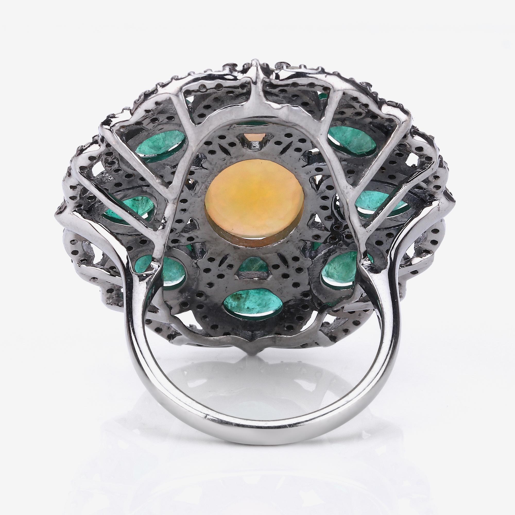 9.80cttw Ethiopian Opal, Emerald with Diamonds 1.31cttw Sterling Silver Ring

This eye-catching ring shows off an eclectic gemstone mix worth fawning over! Featuring multi-color gemstones of emerald, rainbow opal having 9.80 ct. tot. gem wt. along