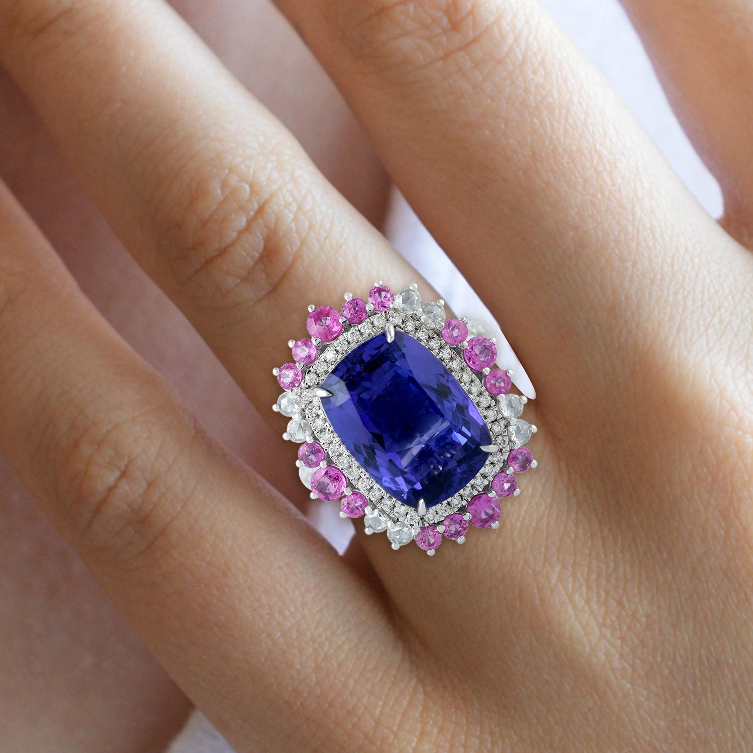 This stunning ring has been meticulously crafted from 18-karat gold. It is hand set with 9.81 carats tanzanite, 1.31 carats sapphire and illuminated with .91 carats of sparkling diamonds. 

The ring is a size 7 and may be resized to larger or