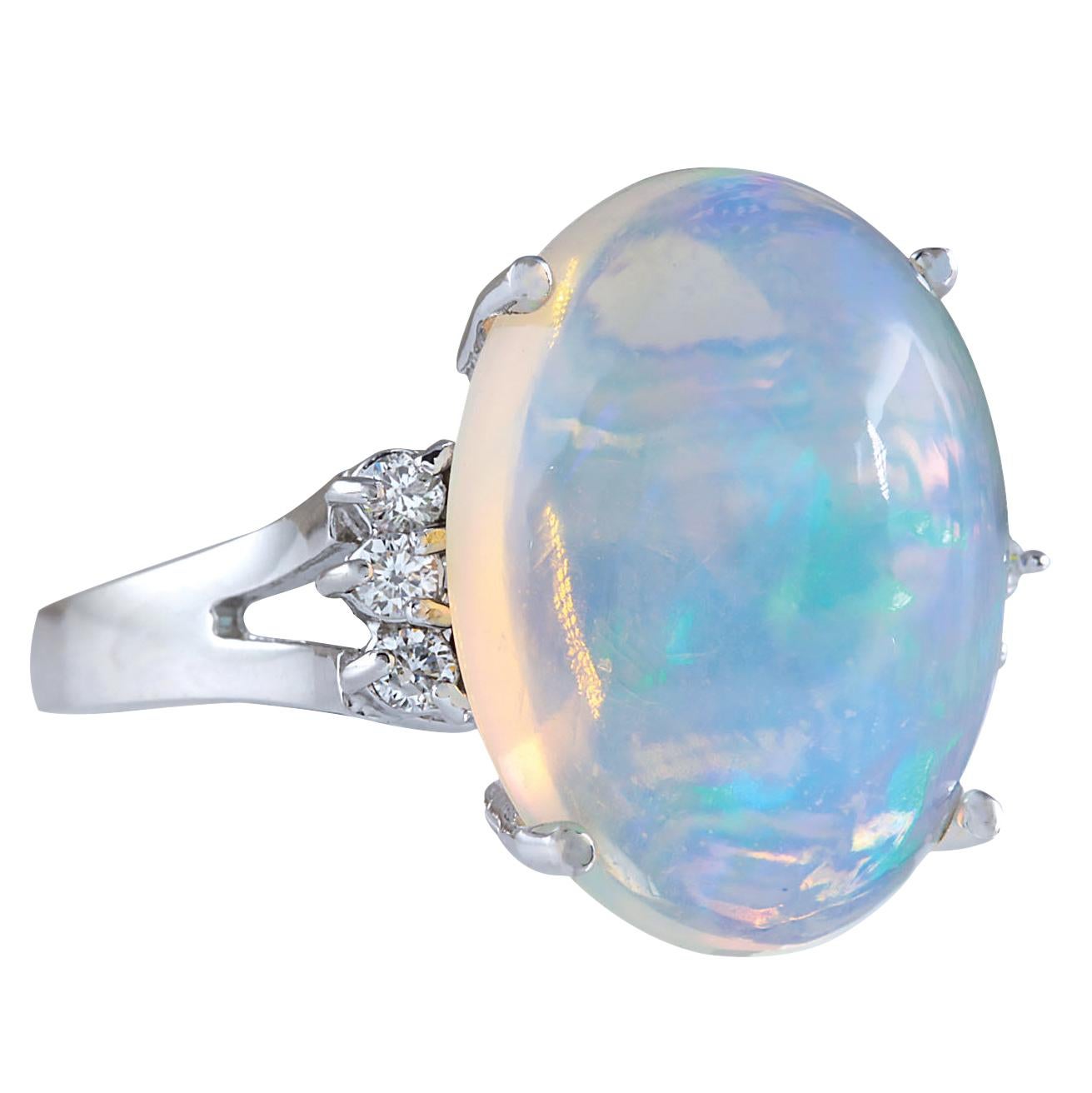 9.82 Carat Natural Opal 14 Karat White Gold Diamond Ring
Stamped: 14K White Gold
Total Ring Weight: 6.0 Grams
Total Natural Opal Weight is 9.62 Carat (Measures: 18.00x13.00 mm)
Color: Multicolor
Total Natural Diamond Weight is 0.20 Carat
Color: F-G,