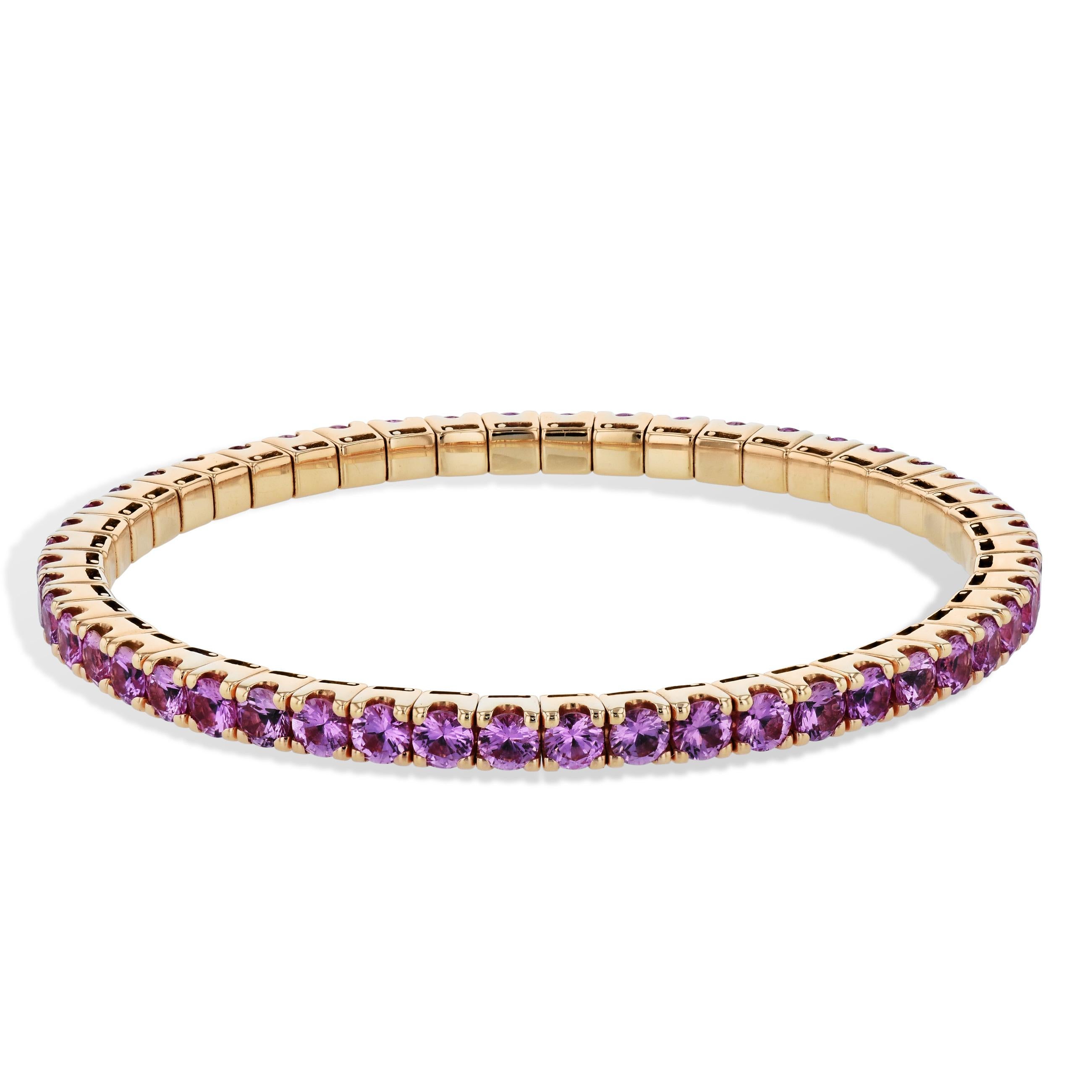 This breathtaking pink sapphire, rose gold, stretch tennis bracelet is a true treasure. 
It boasts 9.83 carats of exquisite pink sapphires set in luxurious 18 karat rose gold. 

Its unique stretch design makes it so easy to wear and gives you the