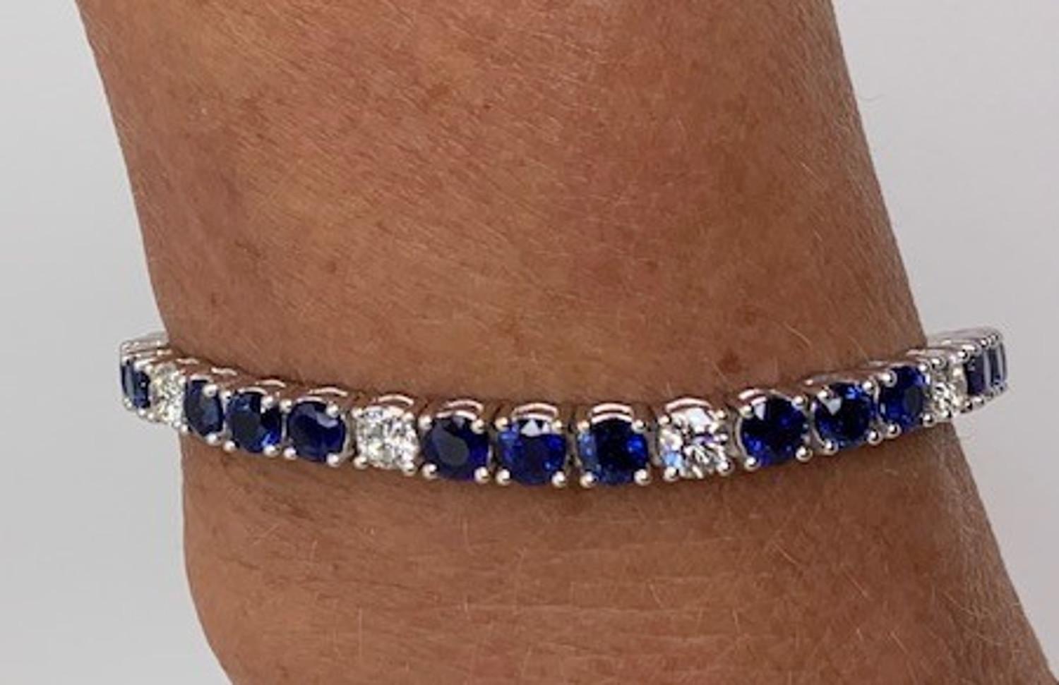 It doesn't get prettier than this! A classic, straight line bracelet set with 30 royal blue gem quality sapphires,  each measuring 4.00mm, with a total weight of 9.85 carats. Ten (10) sparkly, round brilliant cut diamonds that have clarity grade